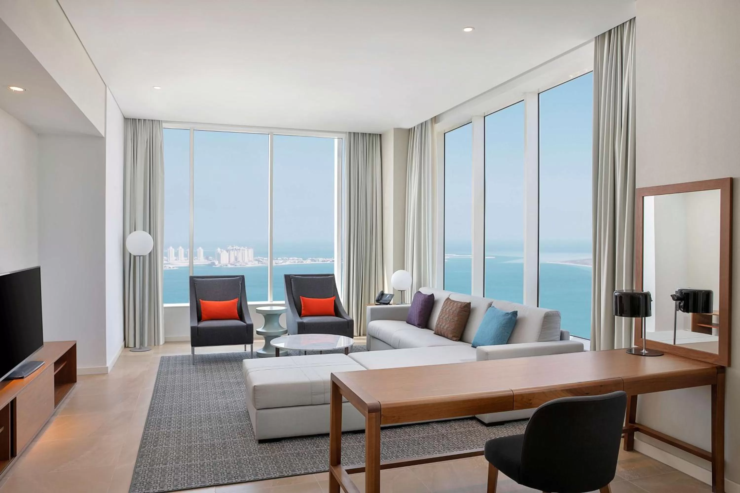 Living room in Aleph Doha Residences, Curio Collection By Hilton