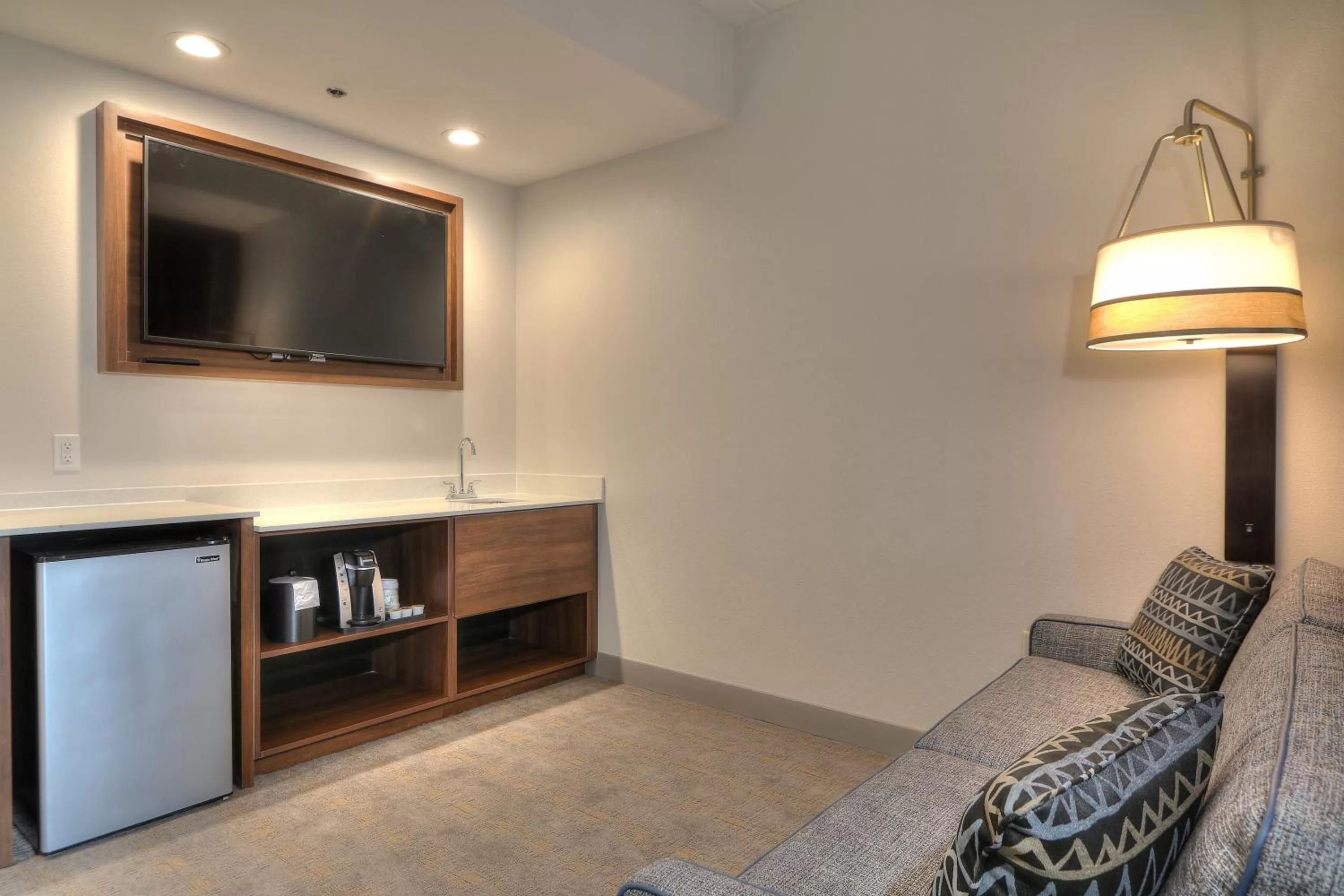 Queen Suite with Two Queen Beds Fireplace and Parkway Balcony in Holiday Inn & Suites Pigeon Forge Convention Center by IHG