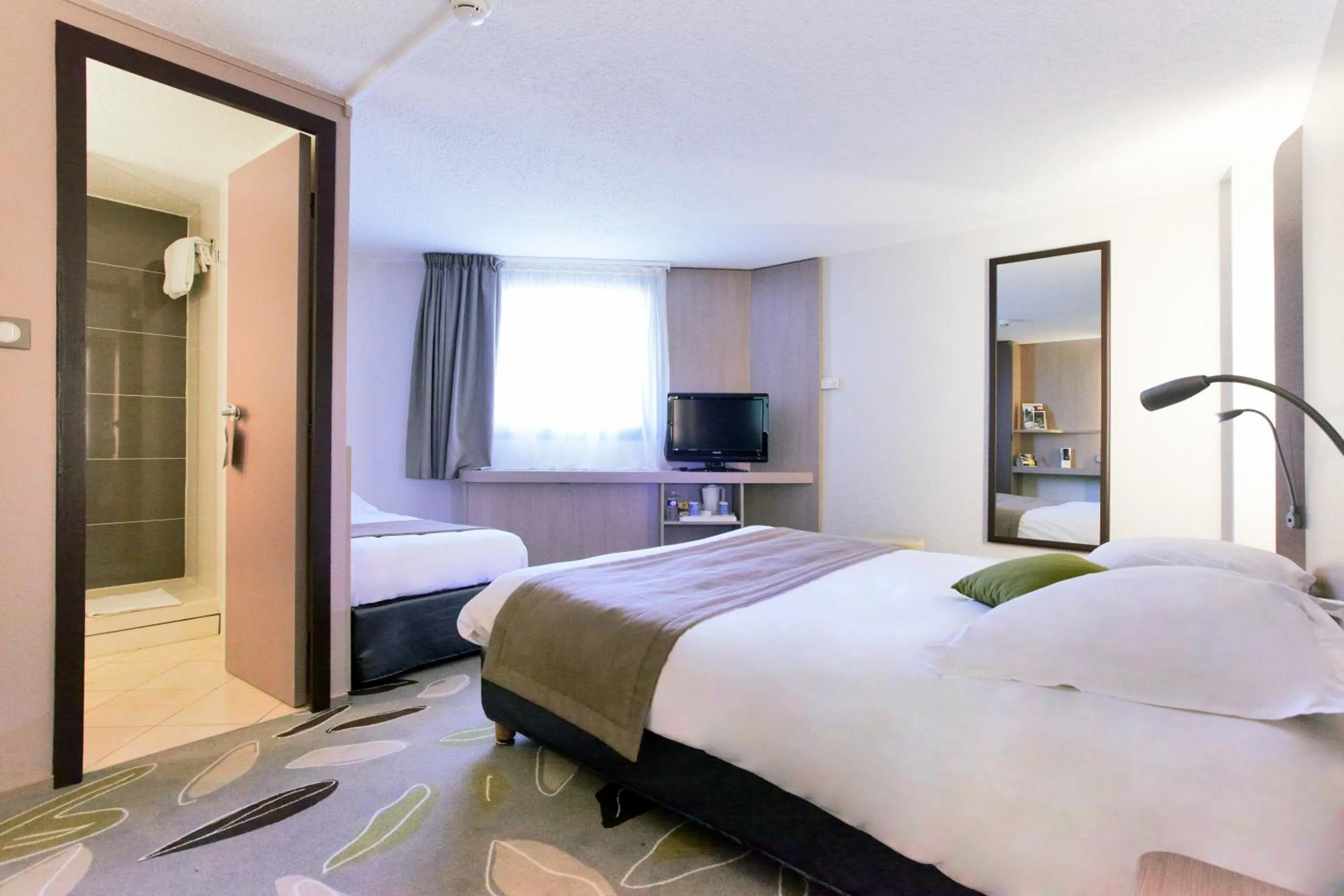 Photo of the whole room, Bed in Kyriad Hotel Nevers Centre