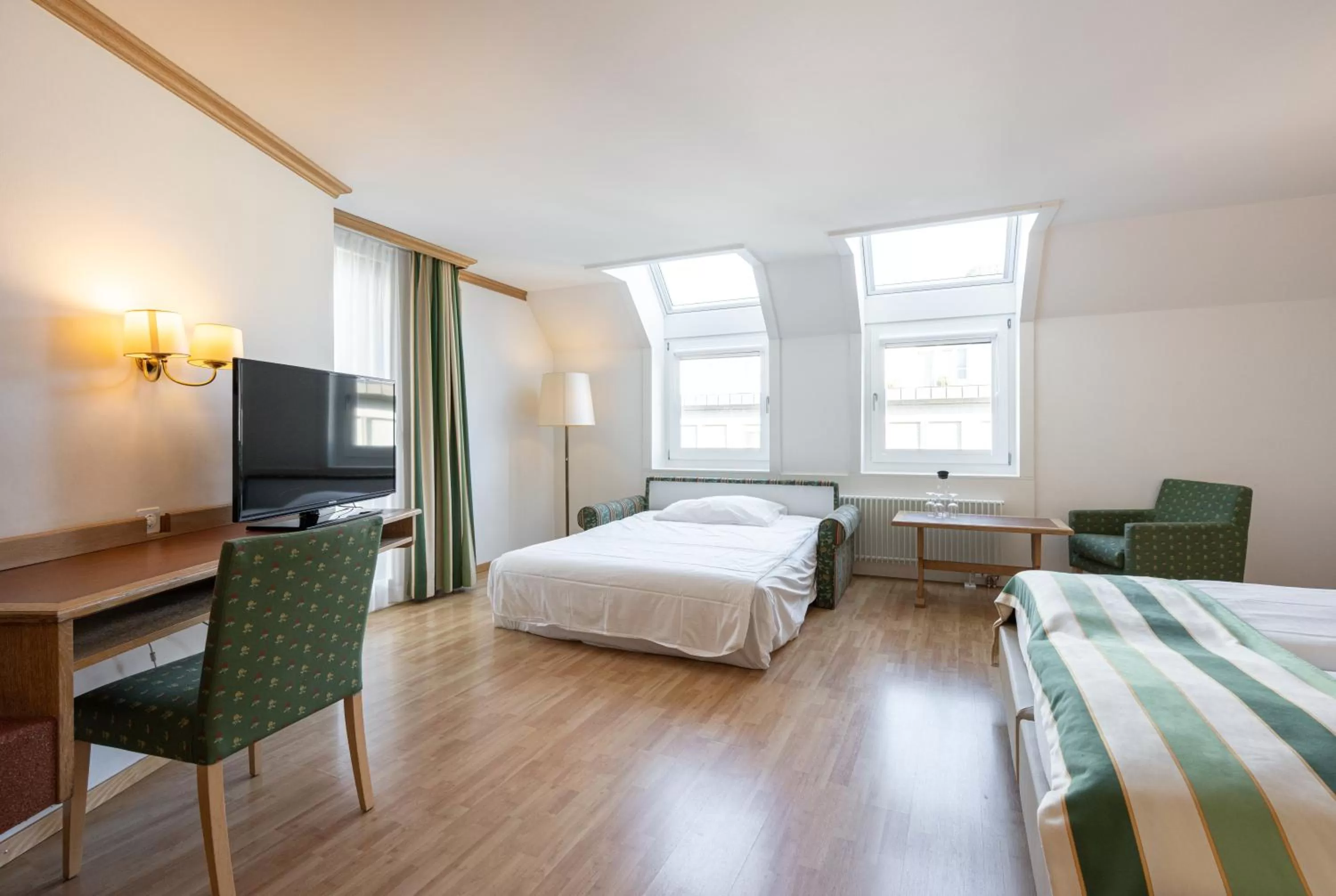 Triple Room in Ambassador Self Check-in Hotel