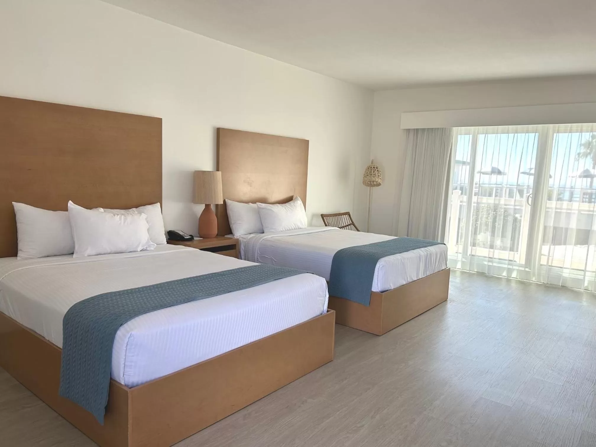 Queen Room with Two Queen Beds - Ocean View in Capri Laguna on the Beach - A Boutique Hotel