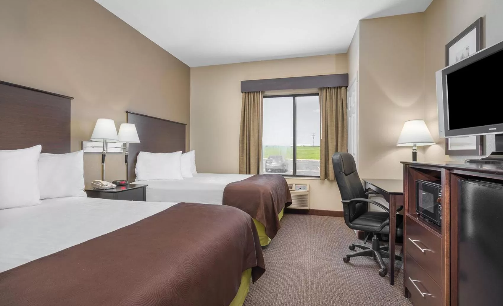 Queen Room with Two Queen Beds - Non-Smoking in AmericInn by Wyndham Rochester