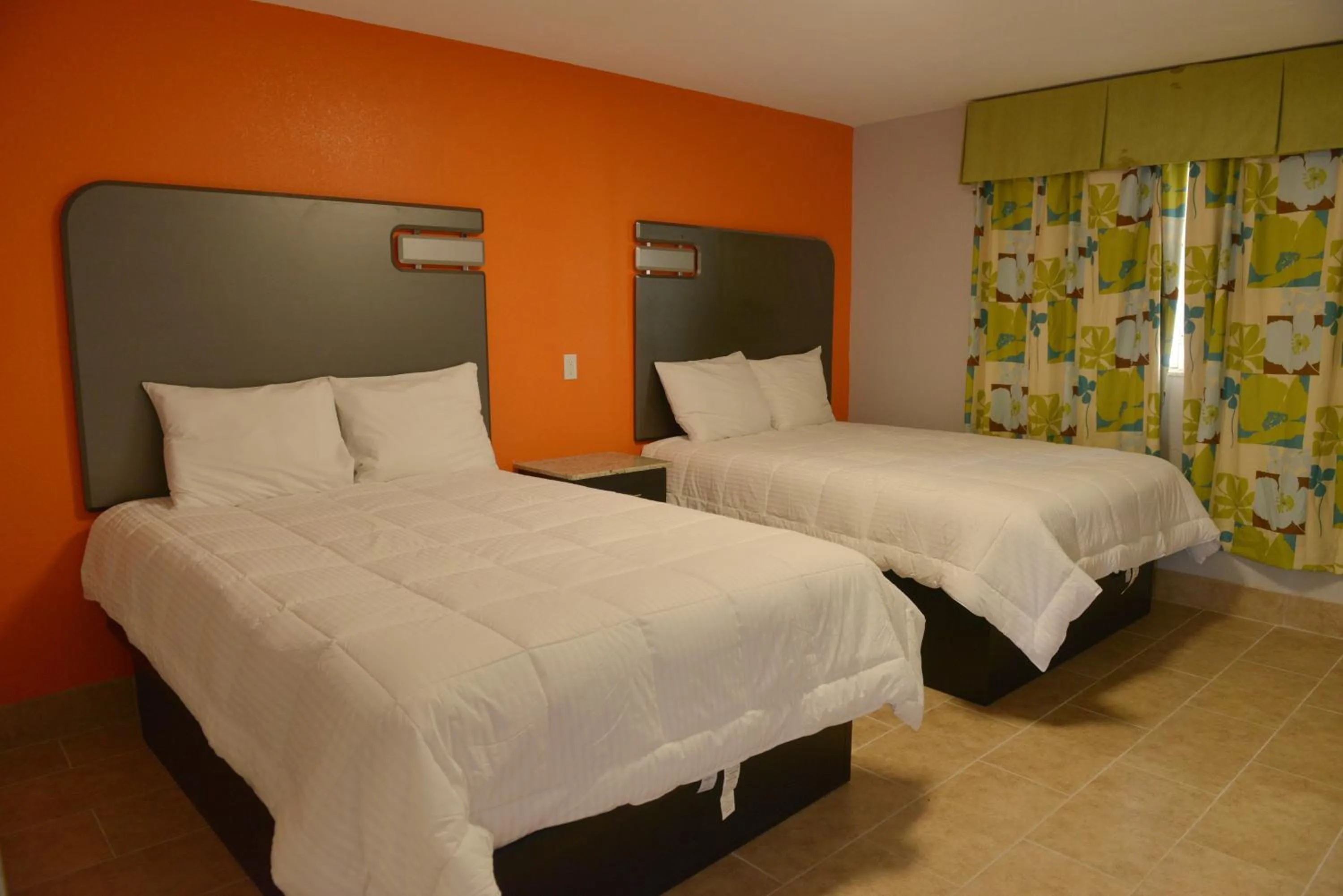 Queen Room with Two Queen Beds - Non-Smoking in Rodeway Inn & Suites Winter Haven Chain of Lakes