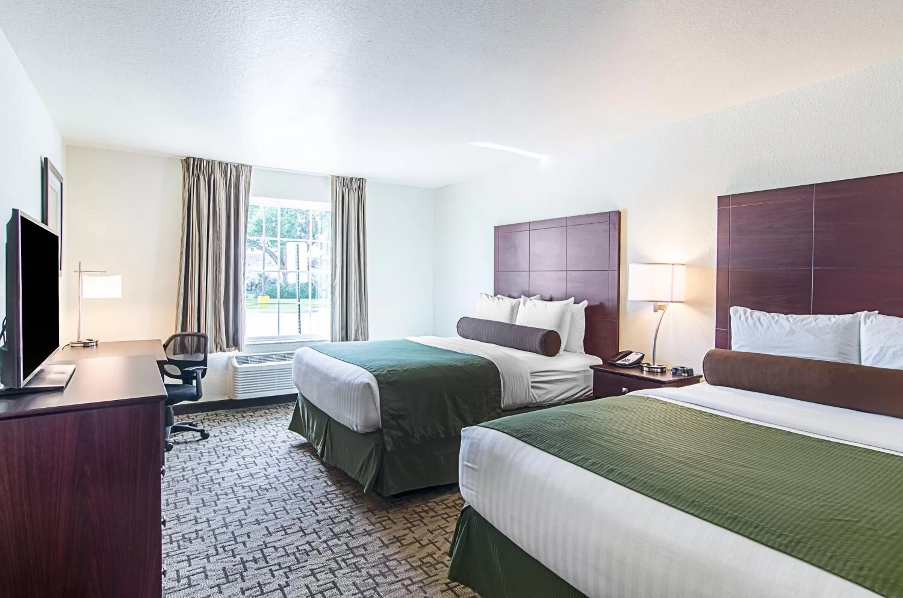 Standard Queen Room with Two Queen Beds in Cobblestone Inn & Suites - Guernsey