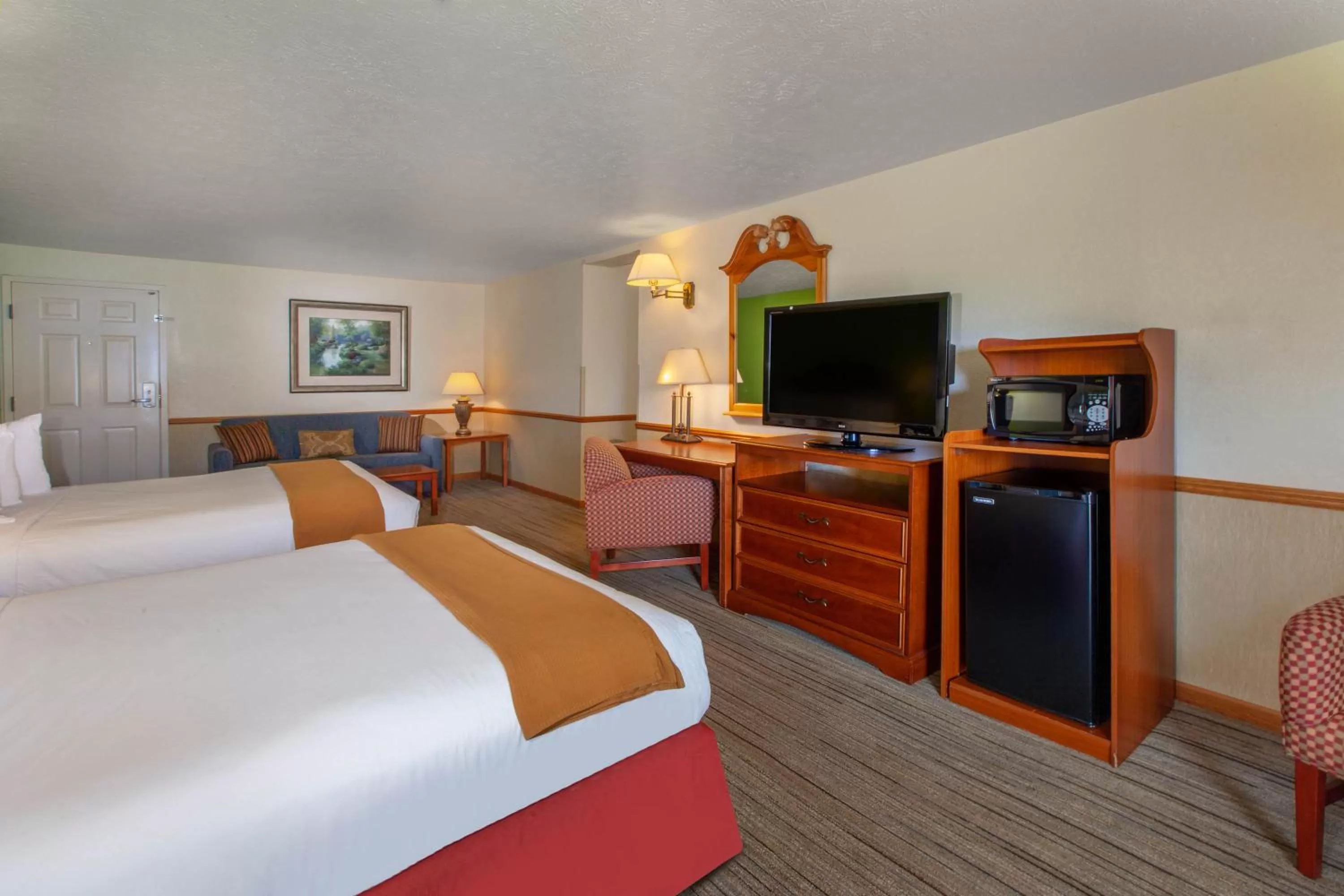 Queen Room with Two Queen Beds and Patio in Apple Tree Inn; SureStay Collection by Best Western