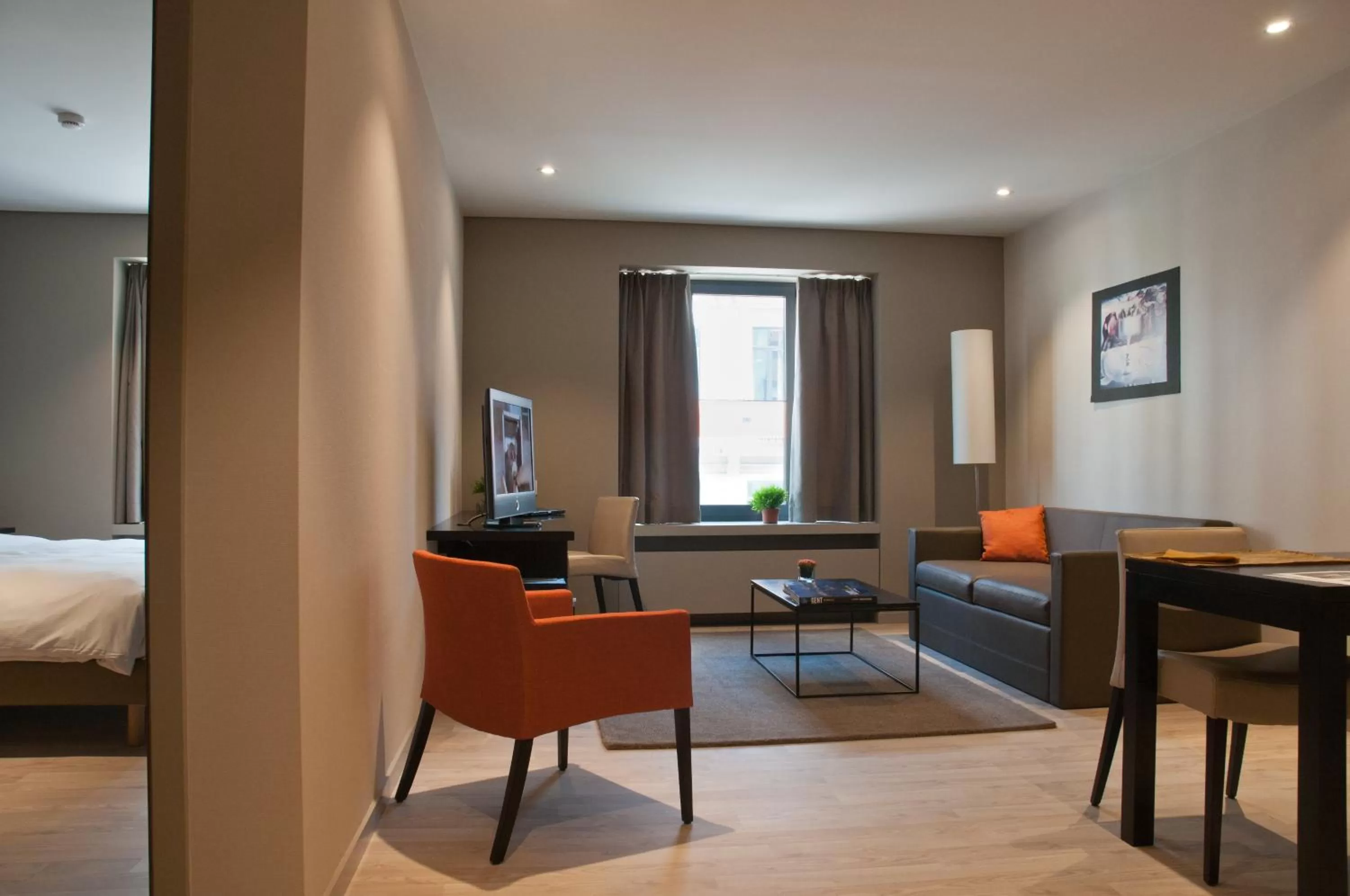 Seating area, Bed in Castelnou Aparthotel