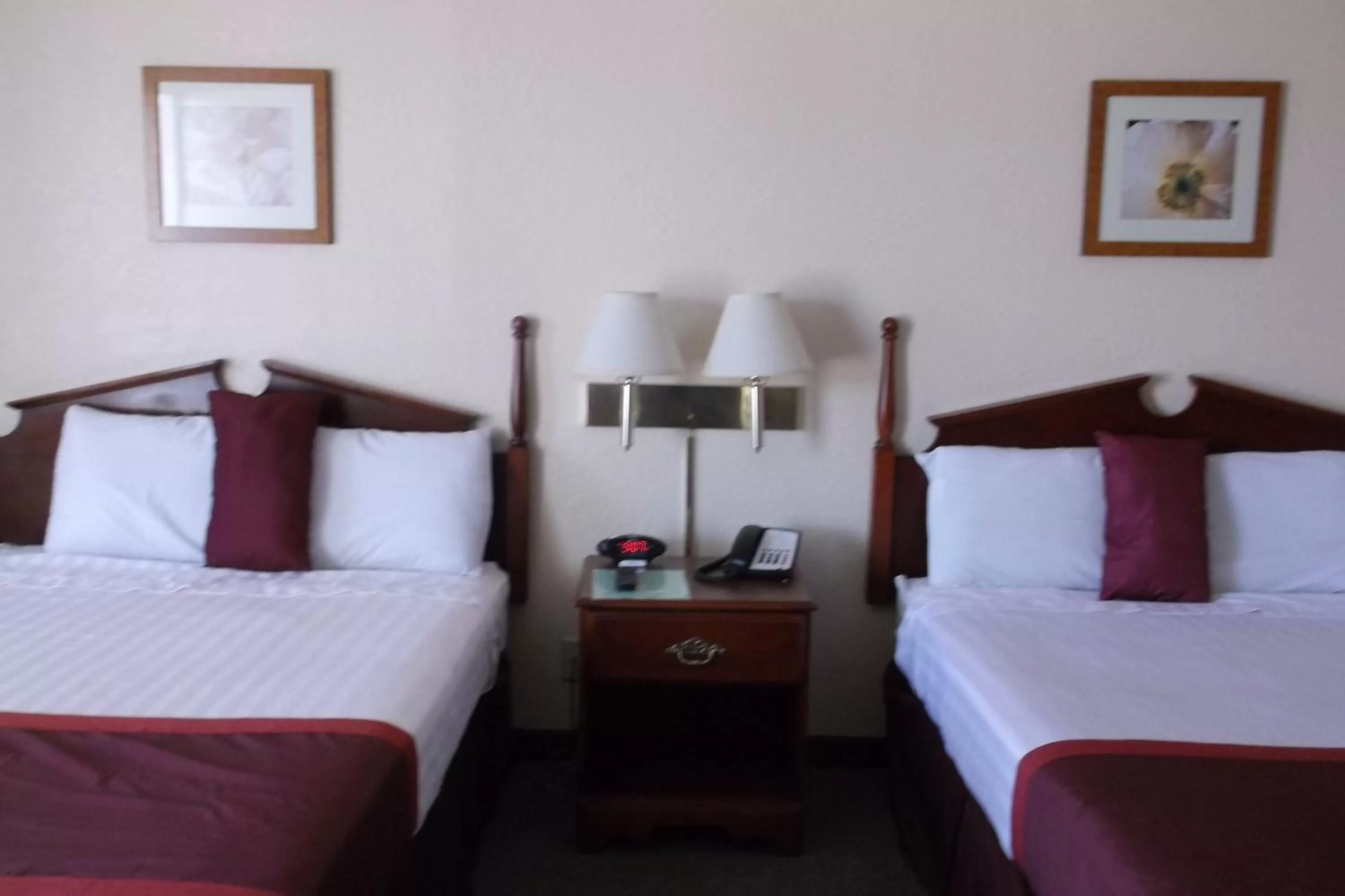 Room with One Queen and One Double Bed - Mobility Access/Non-Smoking in Days Inn & Suites by Wyndham Lake Okeechobee
