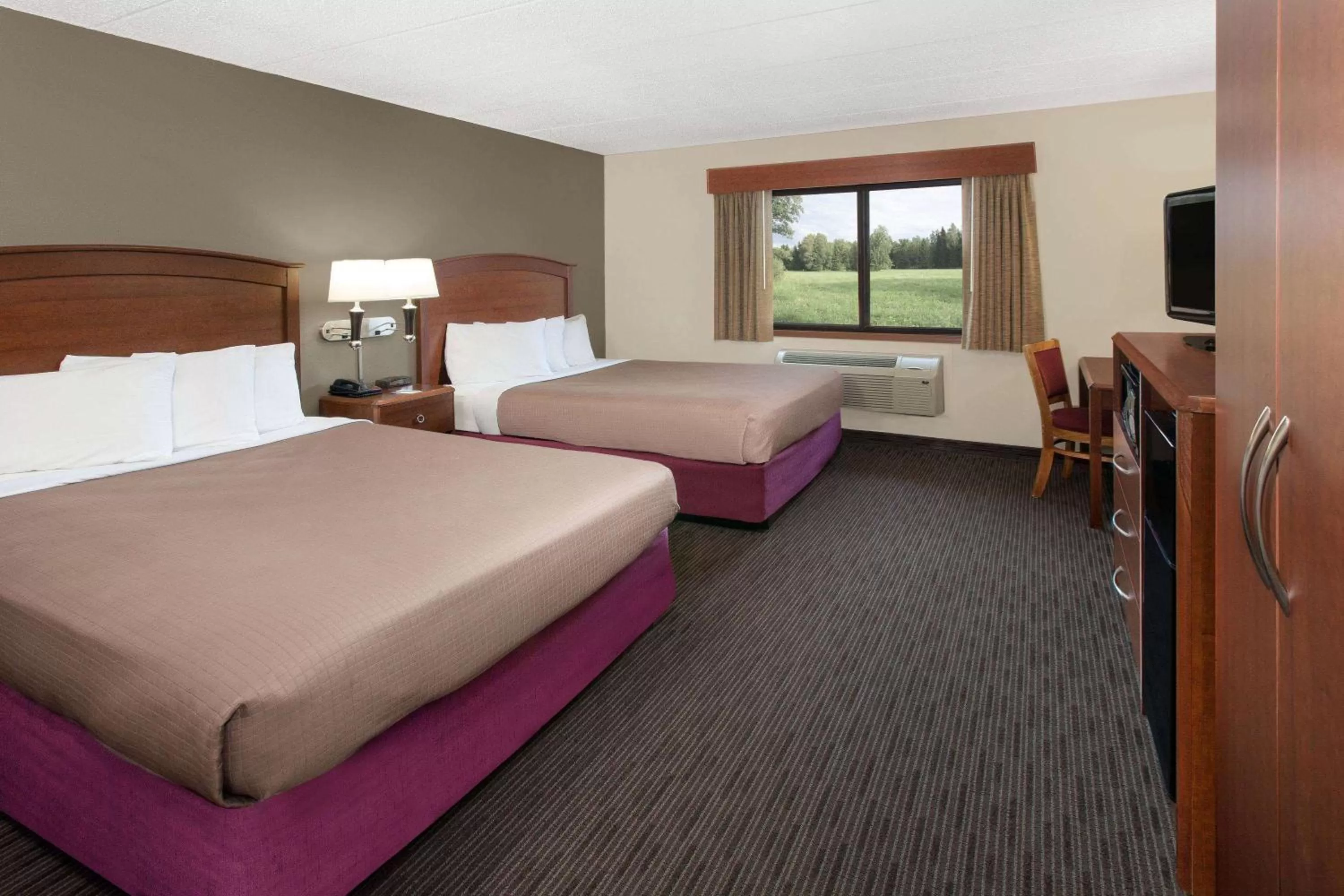 Queen Room with Two Queen Beds - Non-Smoking in AmericInn by Wyndham Grundy Center