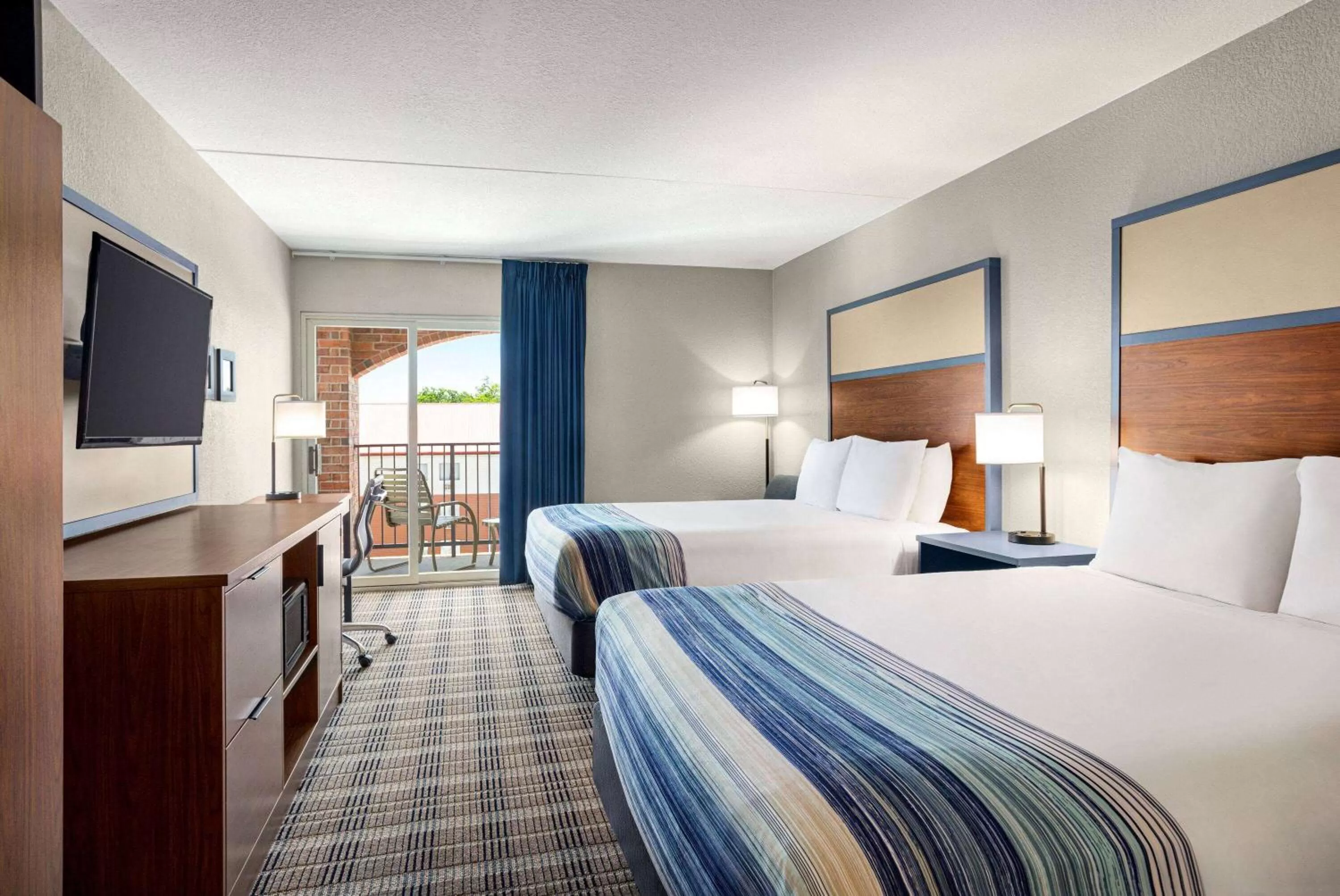 Deluxe Queen Room with Two Queen Beds - Non-Smoking in AmericInn by Wyndham Branson & Conference Center