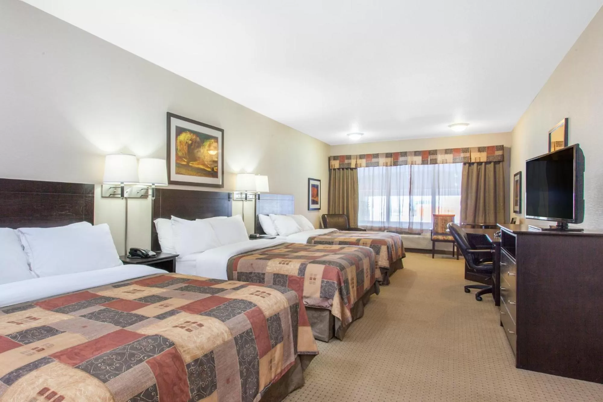 Superior Queen Room with Three Queen Beds - Non-Smoking in Ramada by Wyndham Pincher Creek