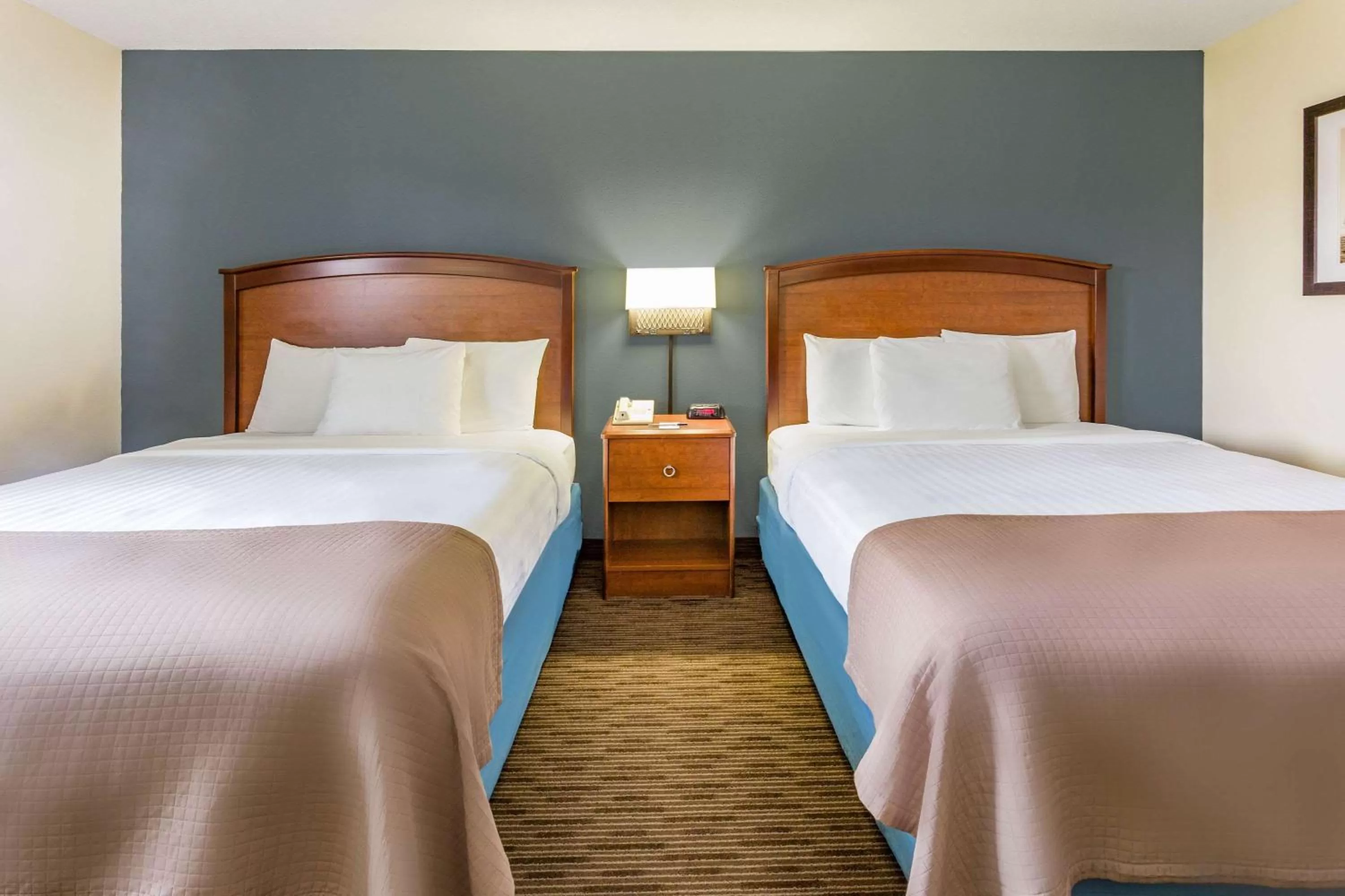 Queen Room with Two Queen Beds - Non-Smoking in AmericInn by Wyndham Princeton MN