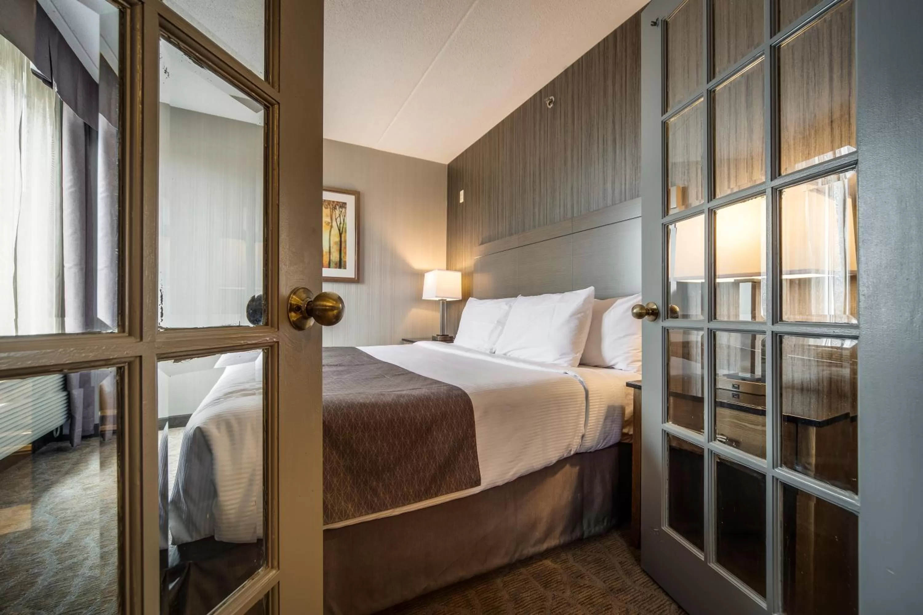 Deluxe King Suite with Jetted Tub and Living Room in Monte Carlo Inn Airport Suites