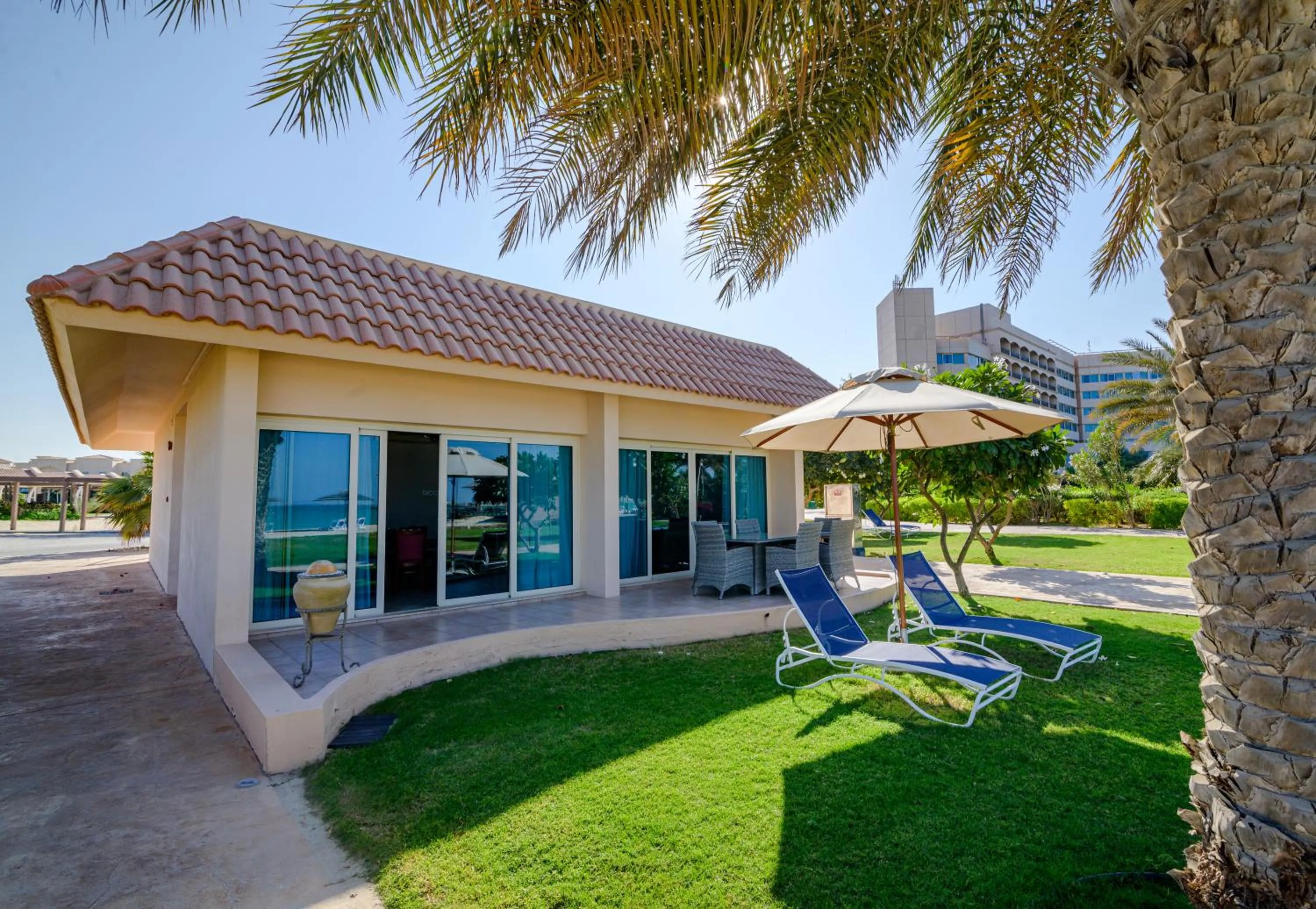 Two Bedroom beachfront family villa with living and dining room, private garden terrace and private parking in Danat Jebel Dhanna Resort