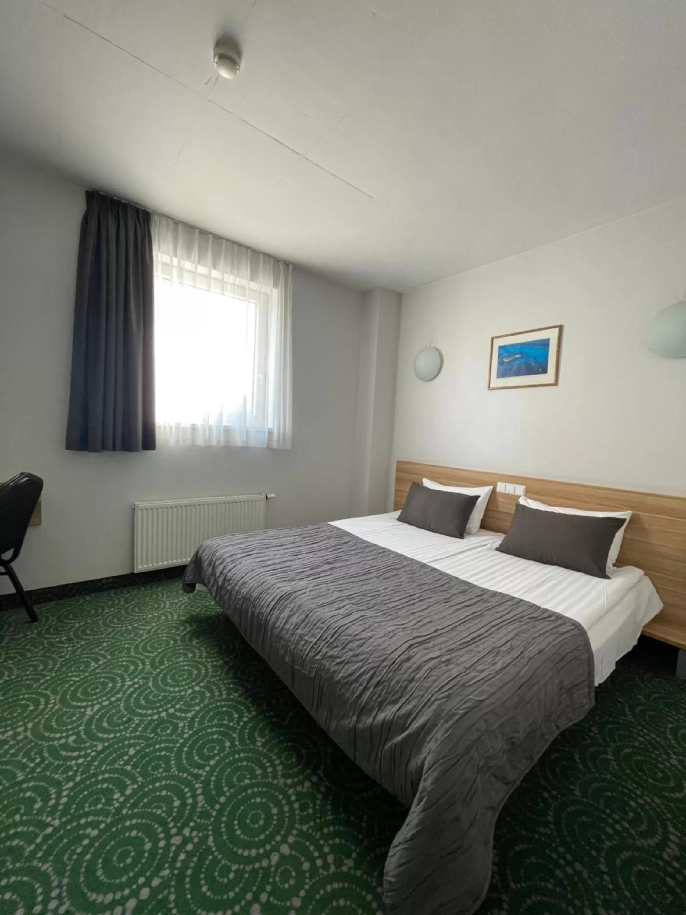 Bed in Green Vilnius Hotel