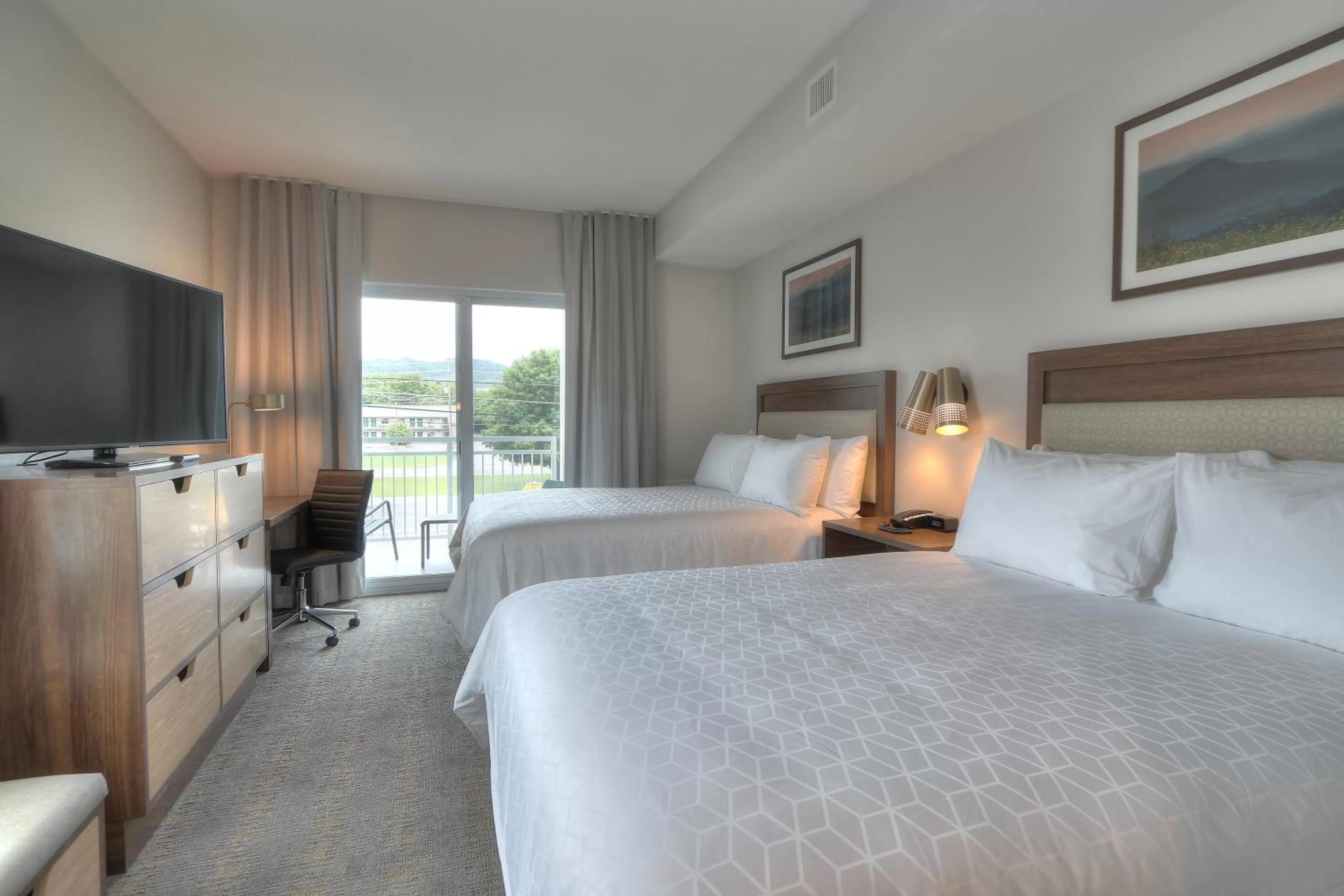 One-Bedroom Suite with Two Queen Beds, Sofa Bed and Balcony in Holiday Inn & Suites Pigeon Forge Convention Center by IHG