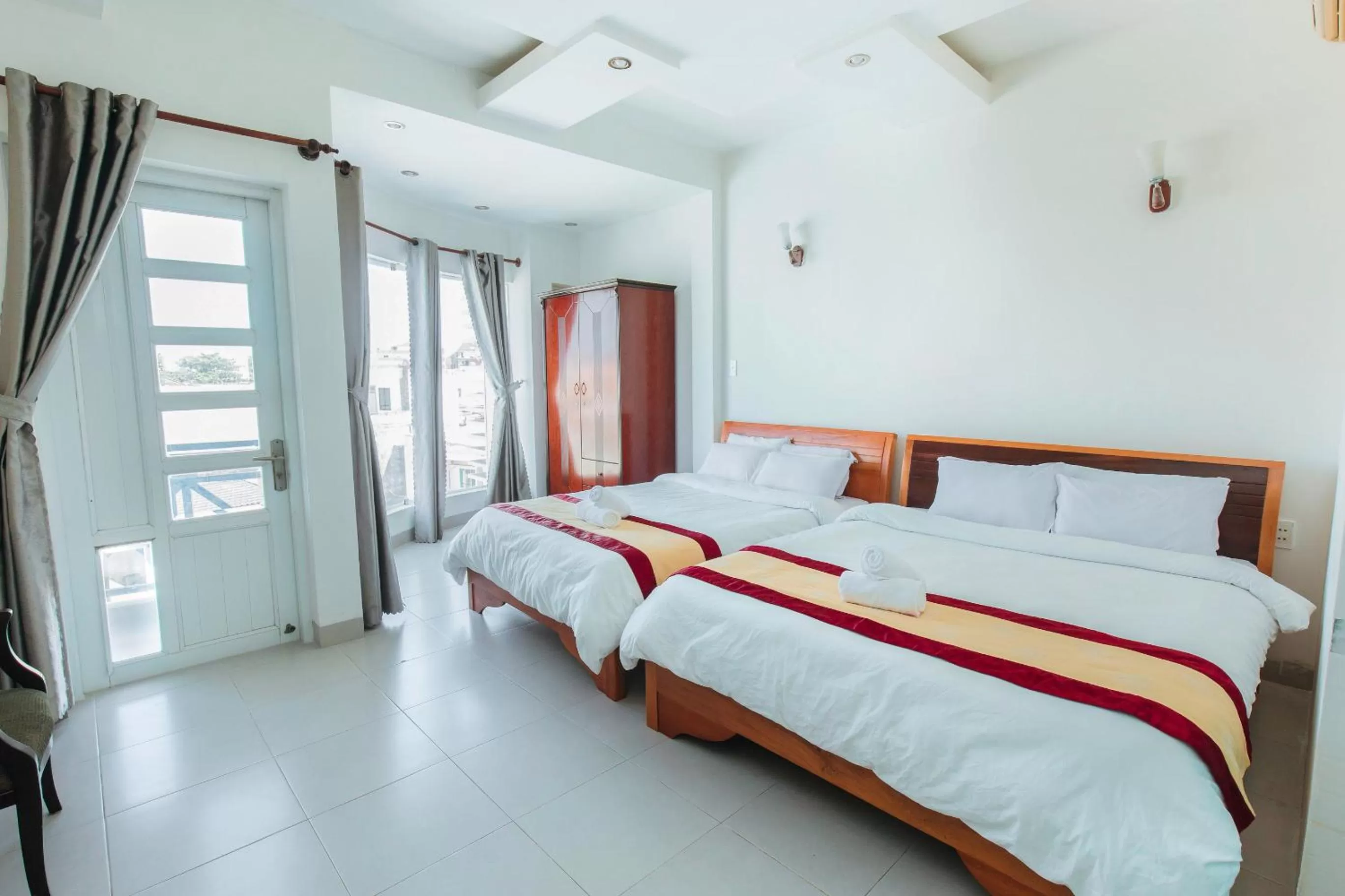 Quadruple Room with Balcony in Phuoc Hai Hotel by The Moment