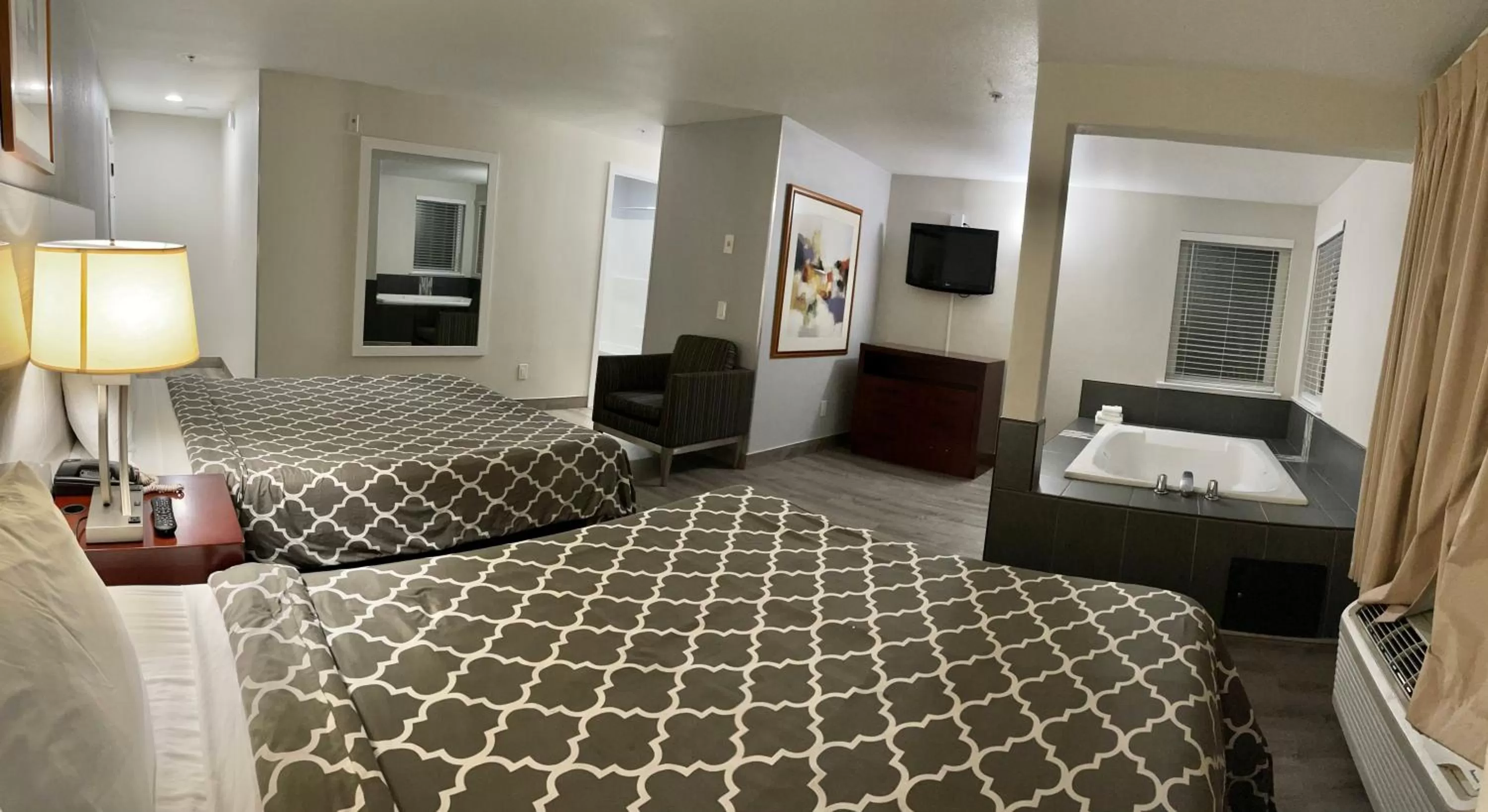 Deluxe Queen Suite with Two Queen Beds in Americas Inn & Suite
