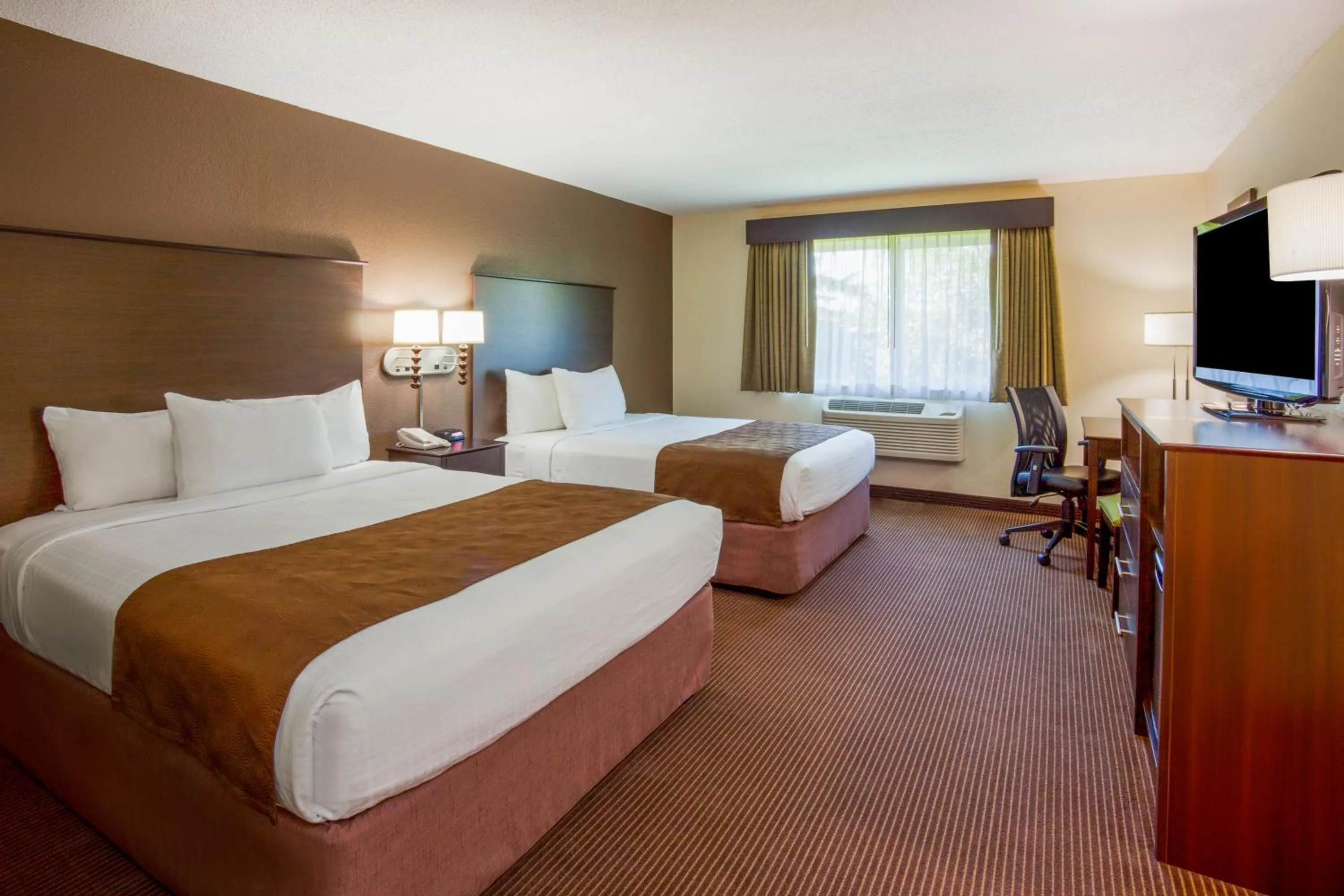Queen Room with Two Queen Beds - Non-Smoking in AmericInn by Wyndham Rhinelander