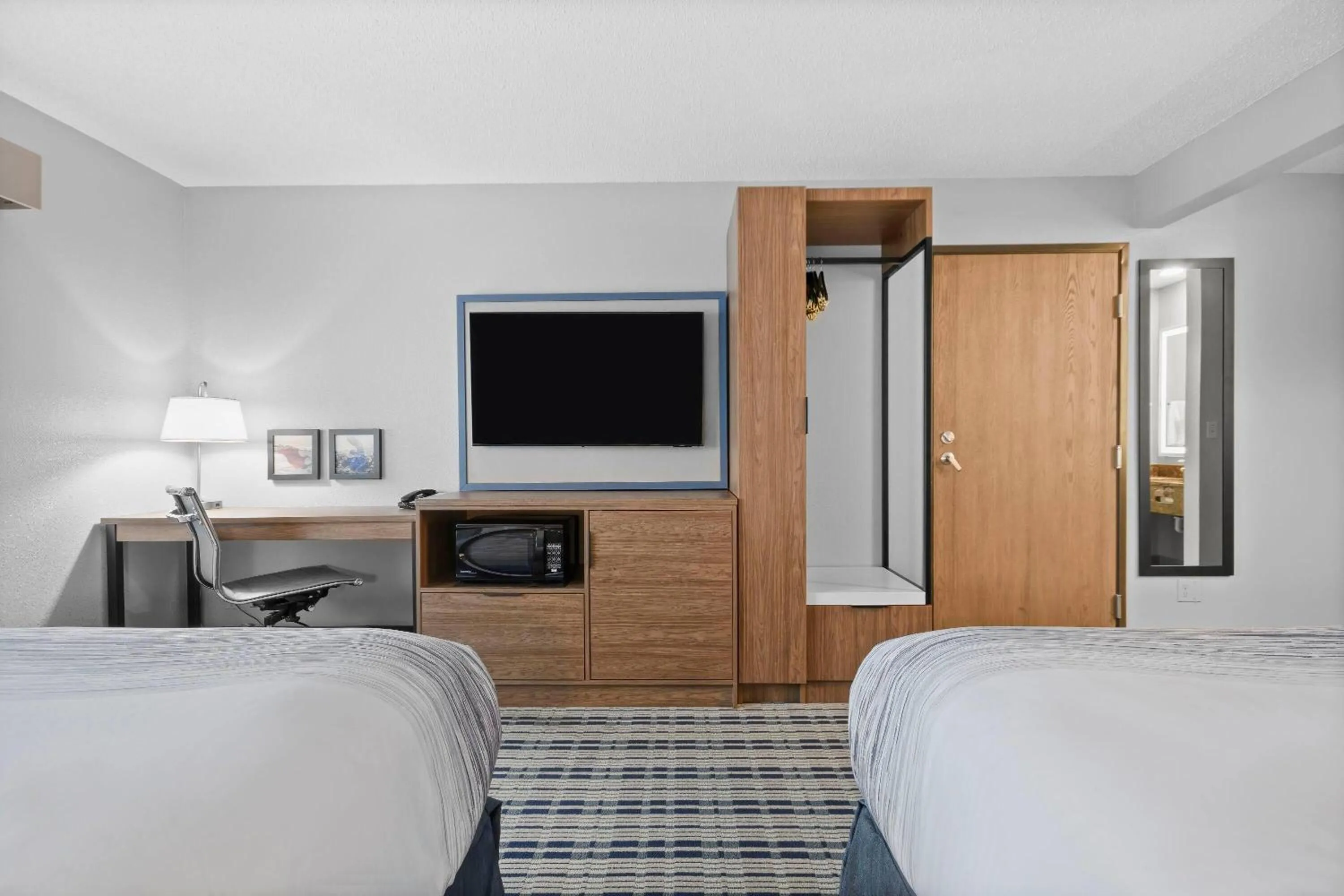 Queen Room with Two Queen Beds - Non-Smoking in AmericInn by Wyndham Virginia