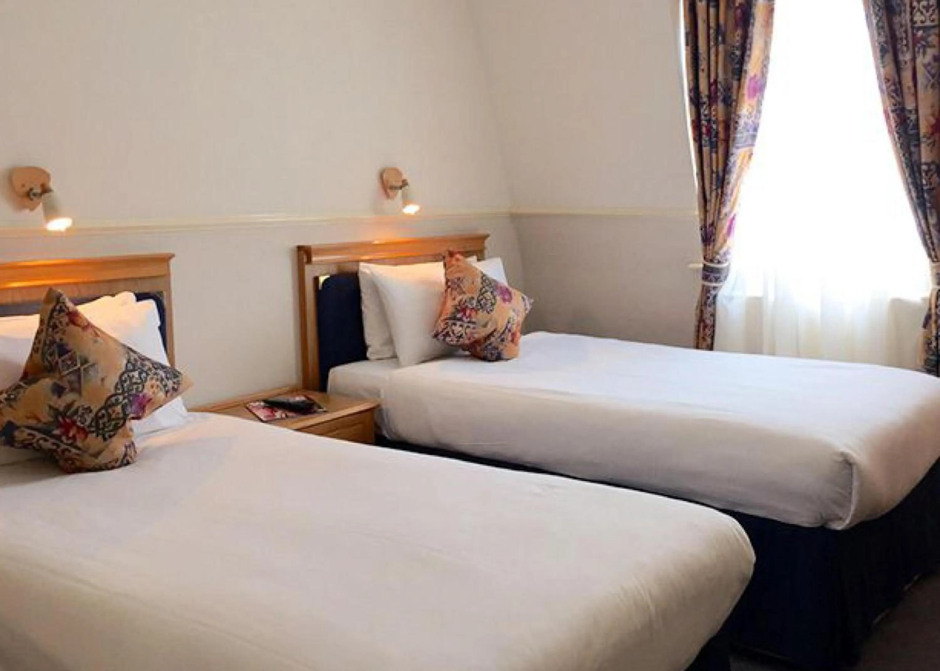 Premier Quad Room in Berjaya Eden Park London Hotel