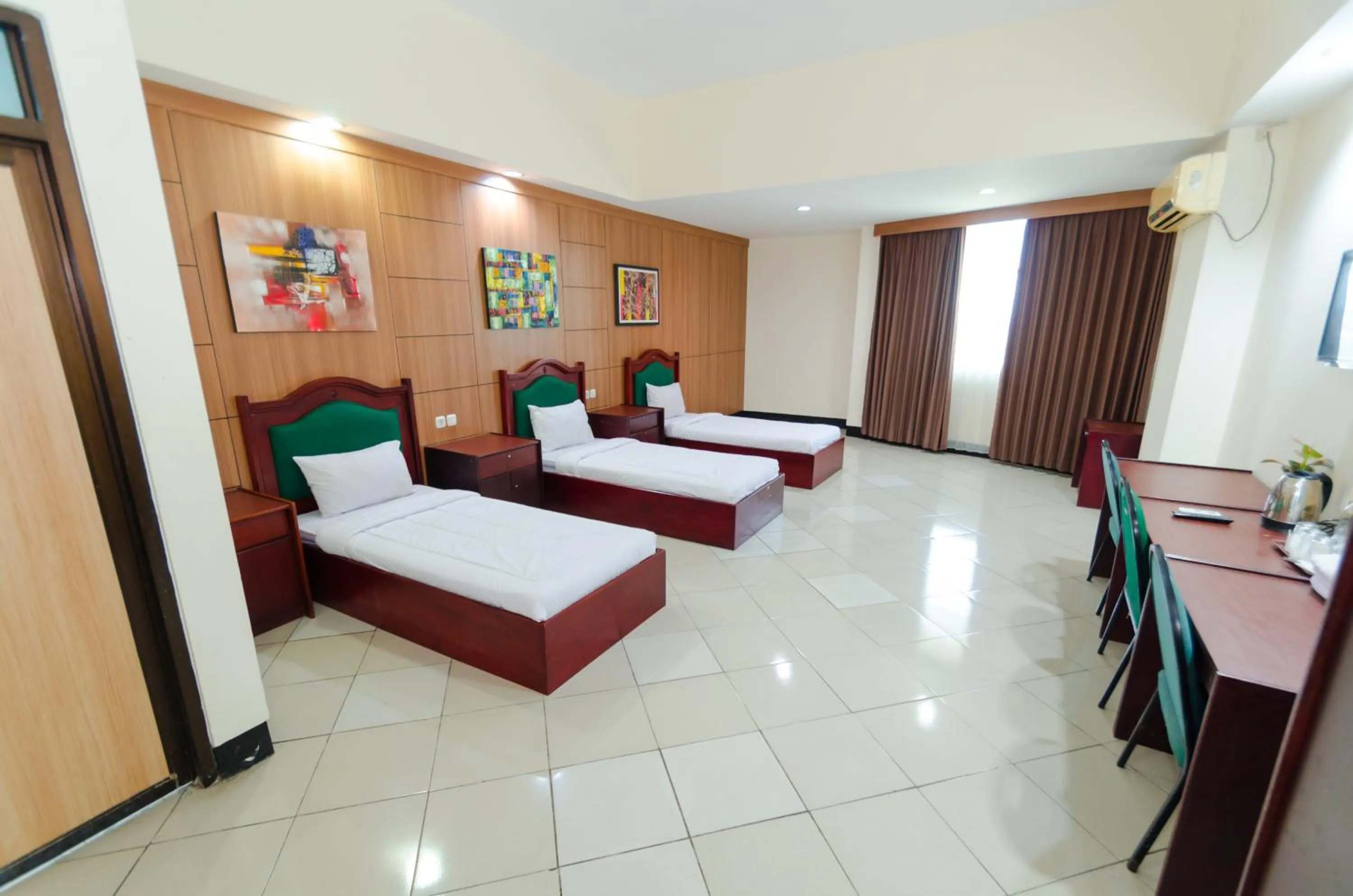 Superior Triple Room in Graha Widya Bhakti at STIESIA Surabaya