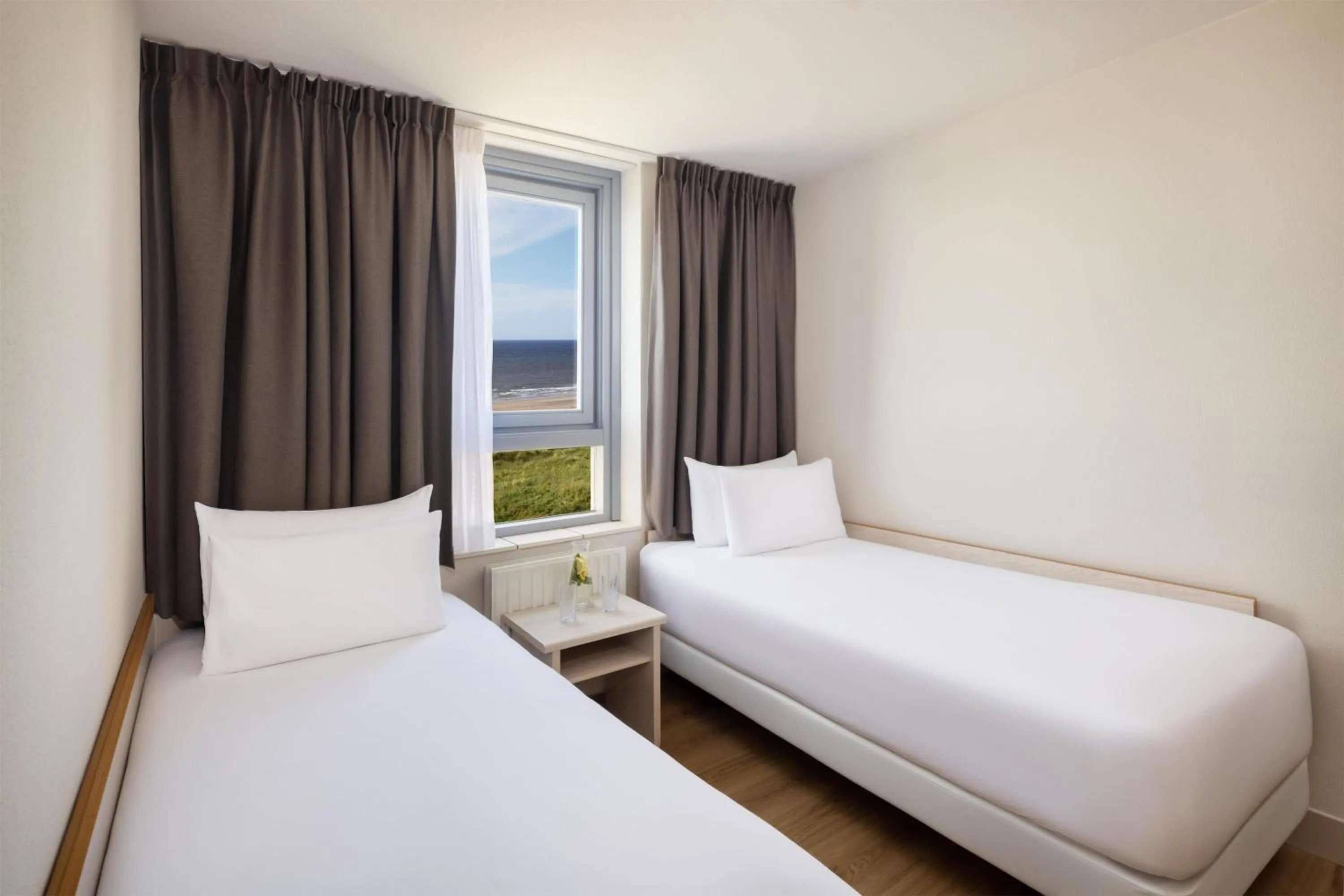Standard Quadruple Room with Sea View in NH Zandvoort Hotel