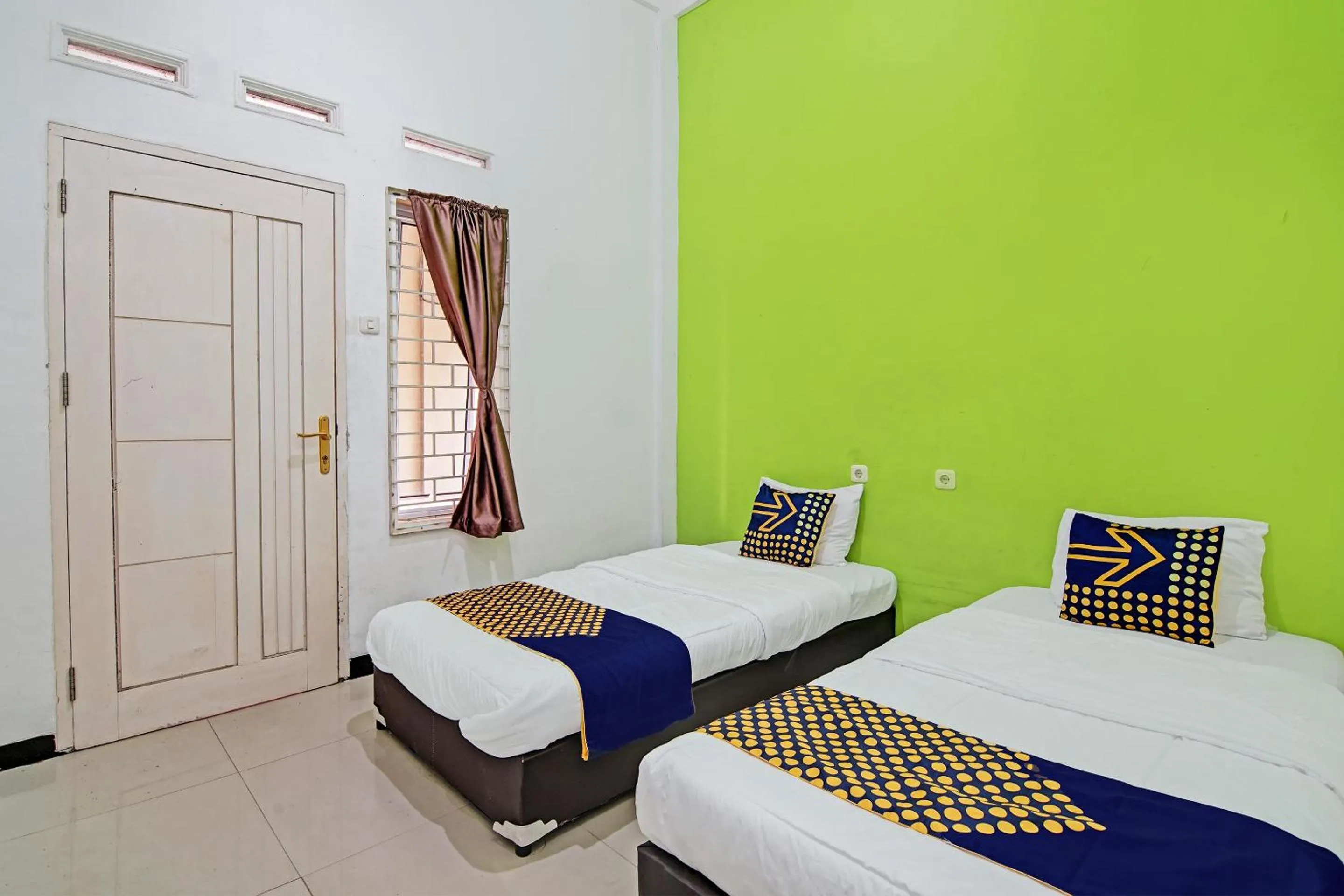 Economy Twin Room in Hotel O Penginapan Puti SyariahNearBandara Sultan Syarif Kasim II