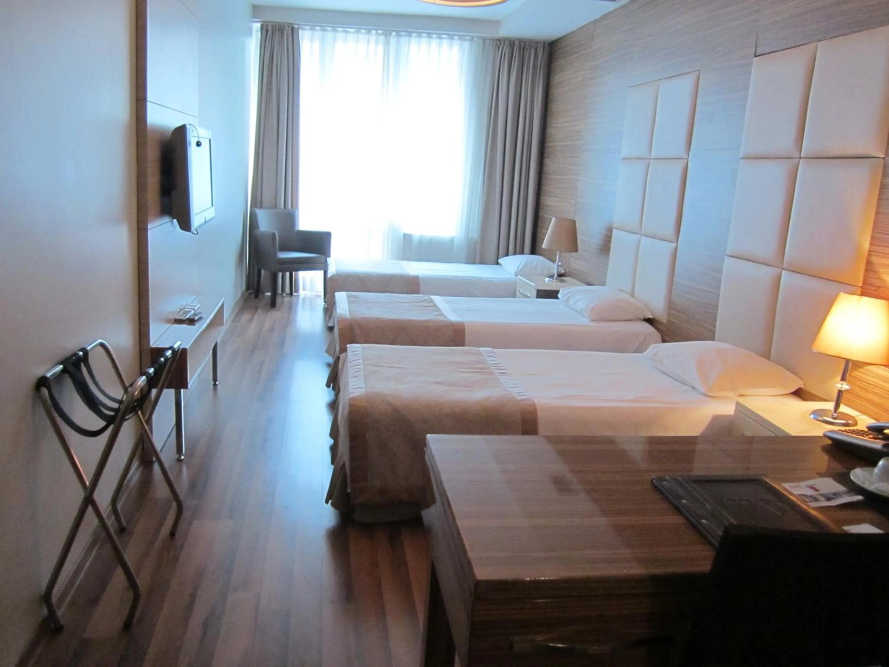 Standard Triple Room in Derpa Suite Hotel