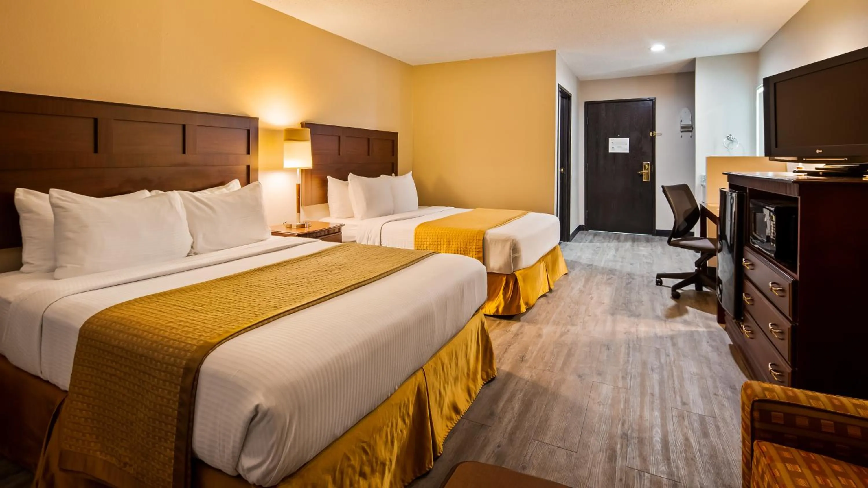 Queen Room with Two Queen Beds and Kitchenette in SureStay Hotel by Best Western Orange