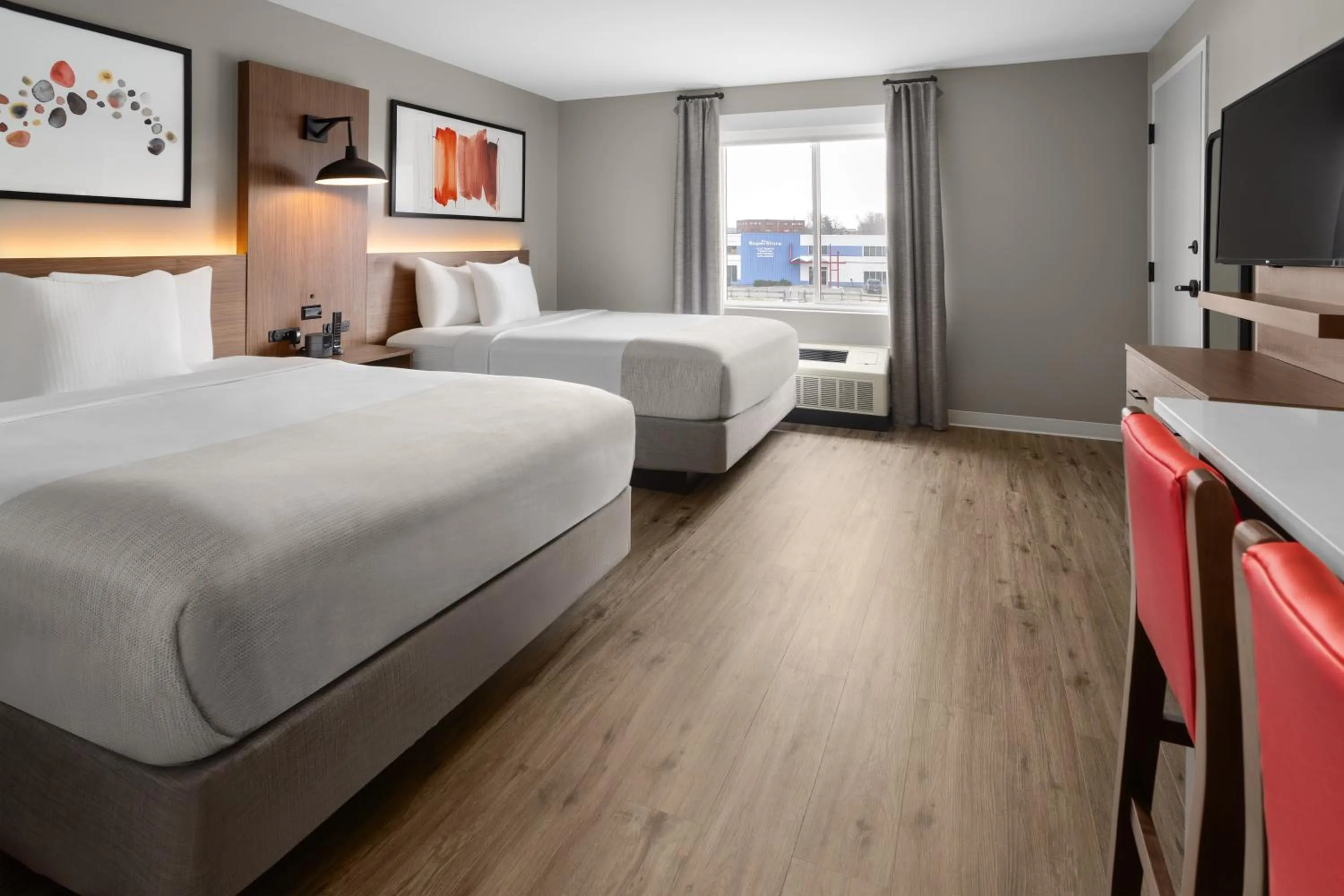 queen Room with Two Queen Beds and Hearing Access, Non-Smoking in Hawthorn Extended Stay by Wyndham Williston Burlington