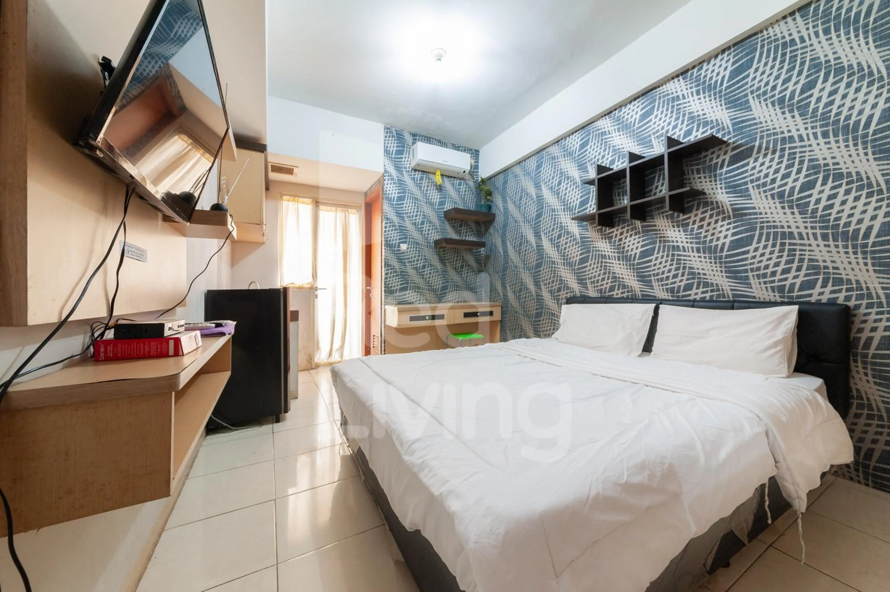 Studio Apartment in RedLiving Apartemen Green Lake View Ciputat - Aurora Rooms