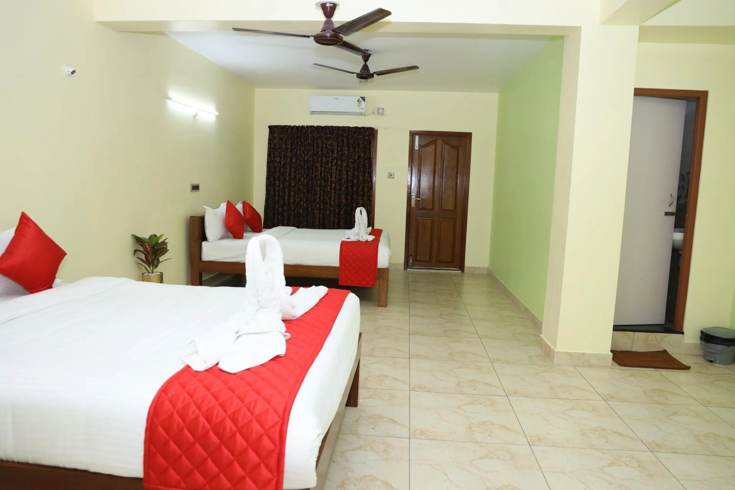 Family Room with Balcony in FabHotel Martine's Residency - French Colony, 5 Mins from Rock Beach