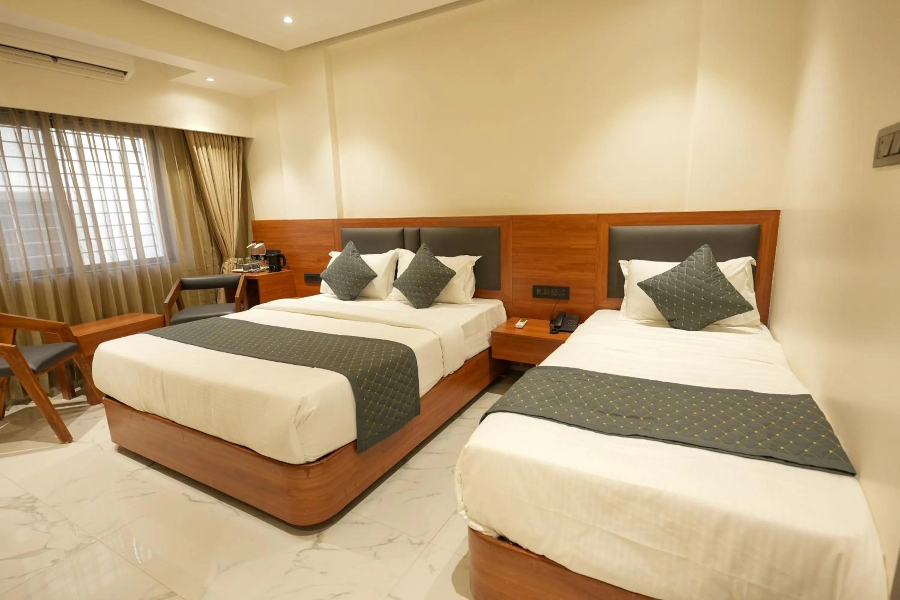 Triple Delight Room - 2 mins walk from Sai Baba temple in Hotel Sai Kamal