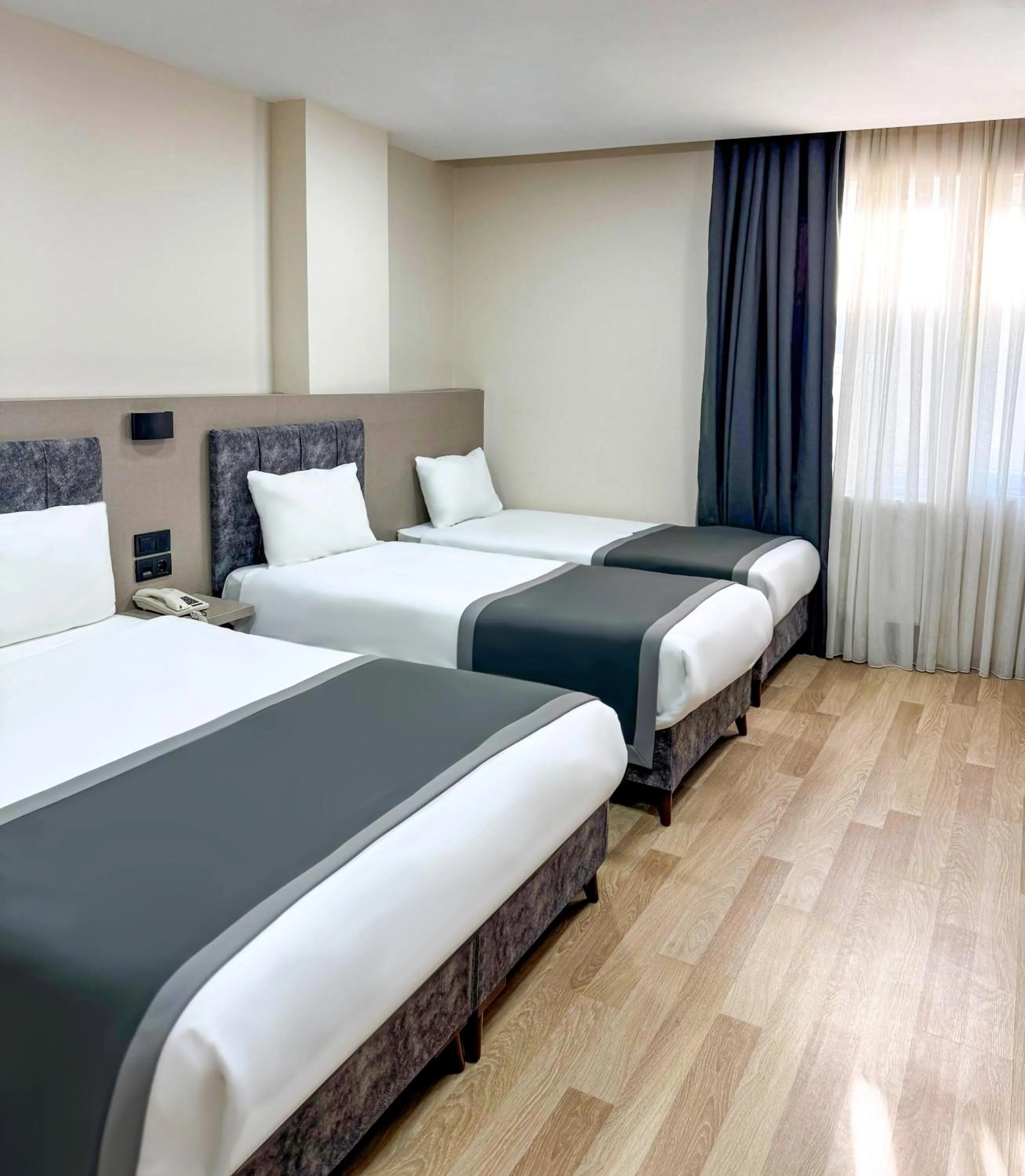 Quadruple Room in The Business Class Hotel