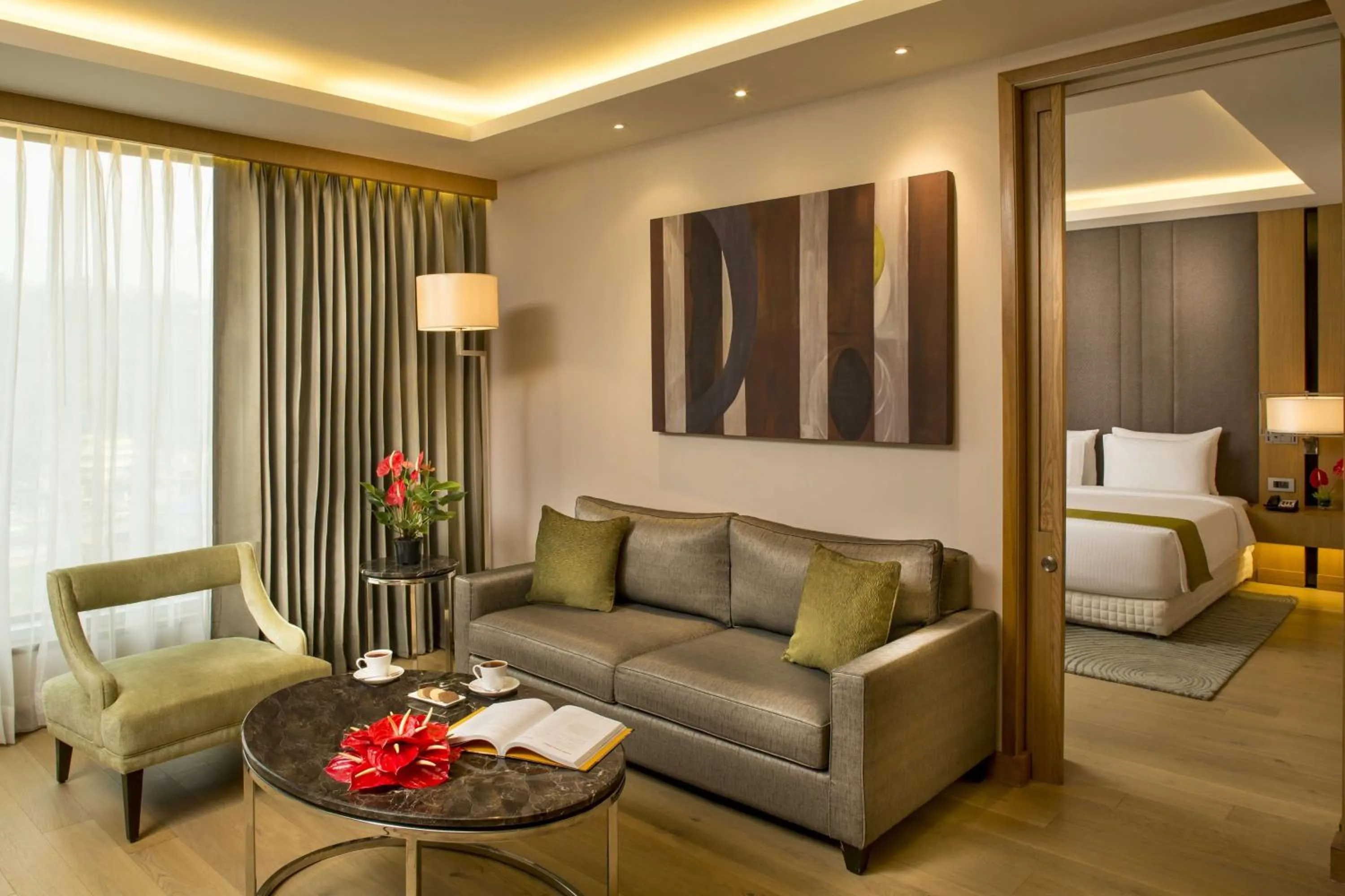 Suite Bedroom with separate living room & bed room with King bed, Bath tub , free Wi-fi , 2 way airport transfer, bottle of complimentary House wine in Radisson Blu Hotel Guwahati