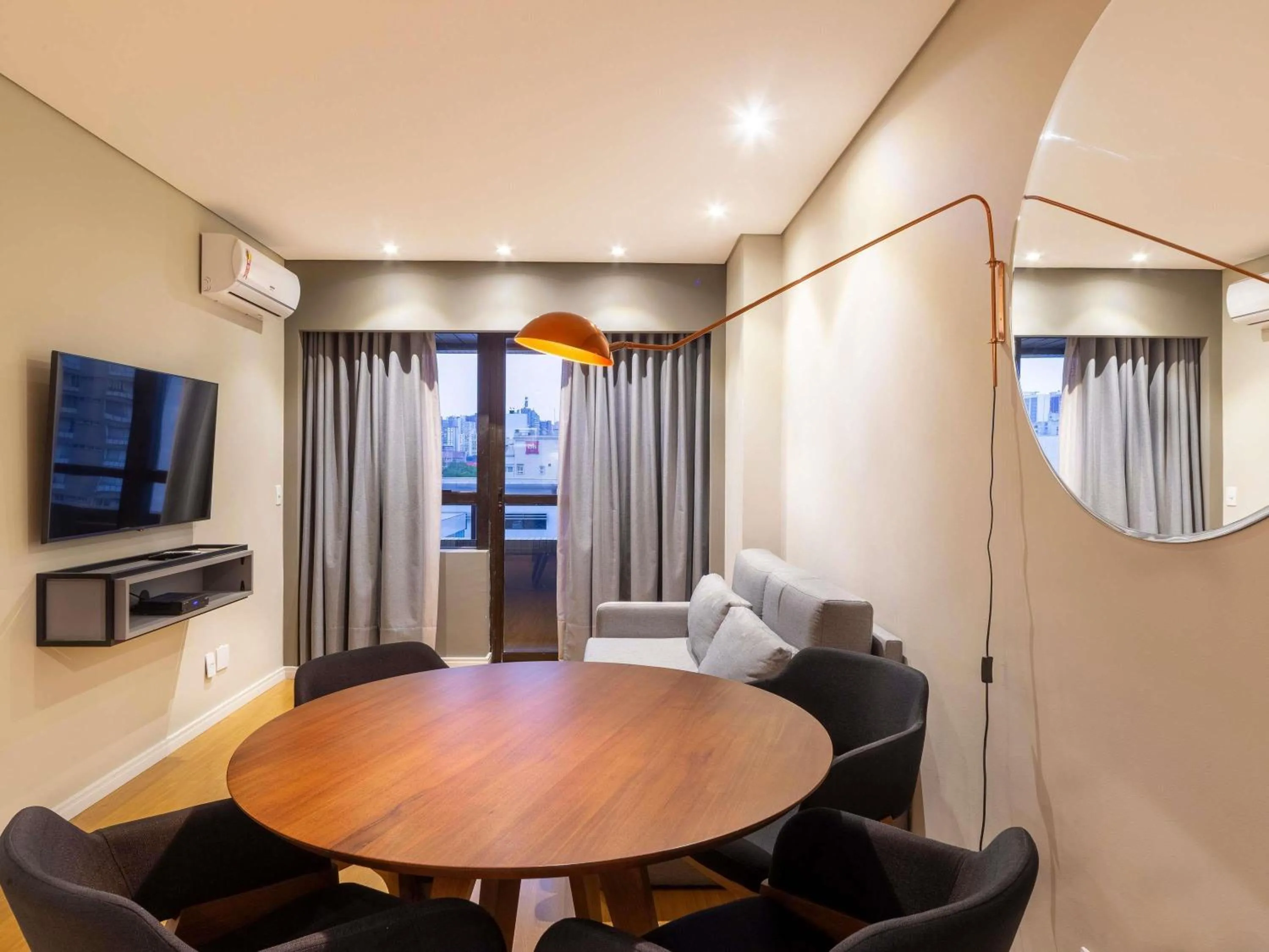 Family Room with One Double Bed, Two Single Beds and One Sofa Bed in Mercure Curitiba Golden