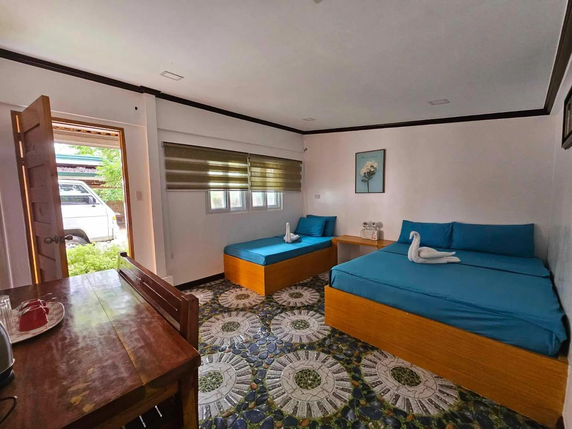 Triple Room in Tambayan Rooms and Cottages by SMS Hospitality