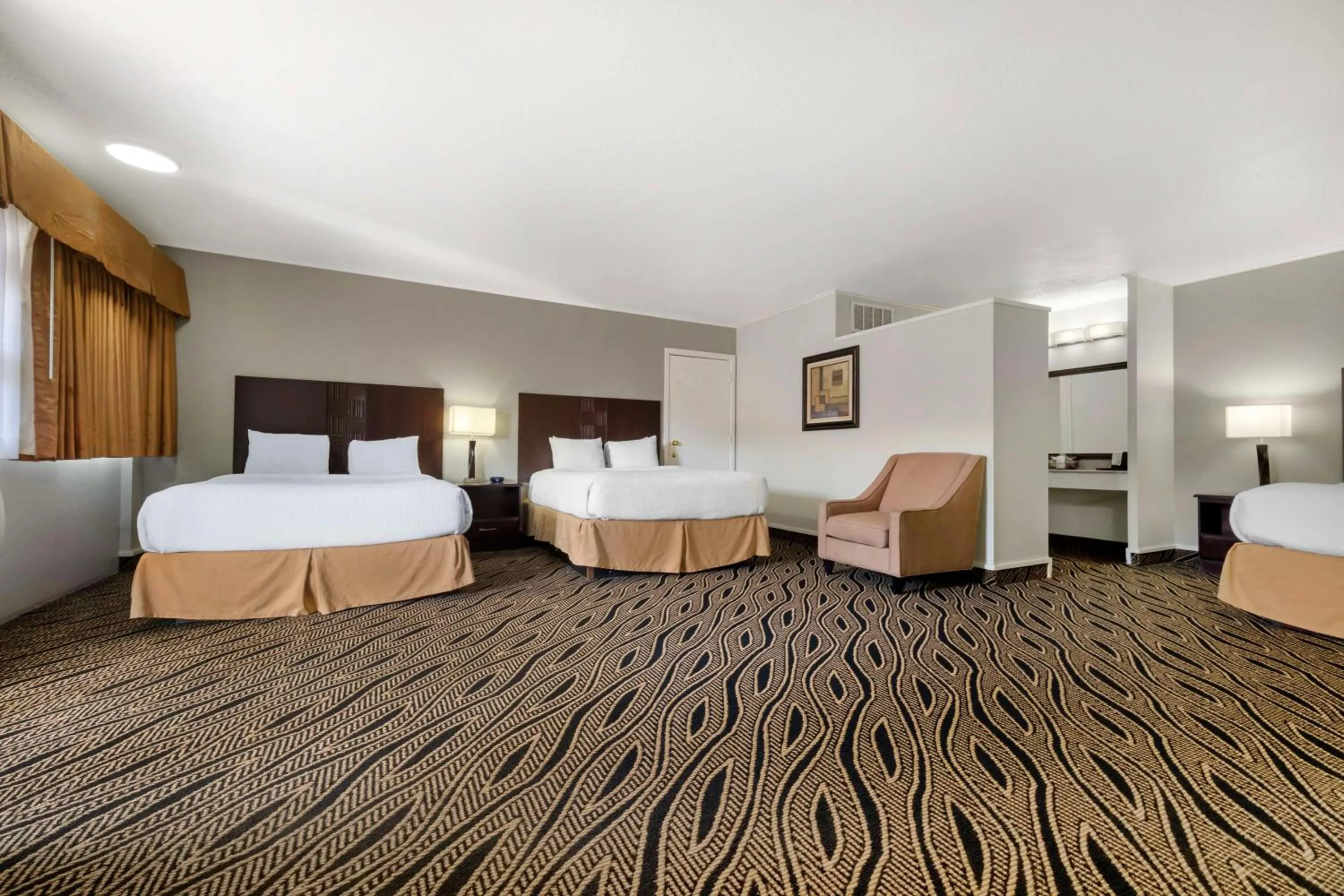 Queen Rooms with Three Queen Beds - Smoking Room in Best Western Red Carpet Inn