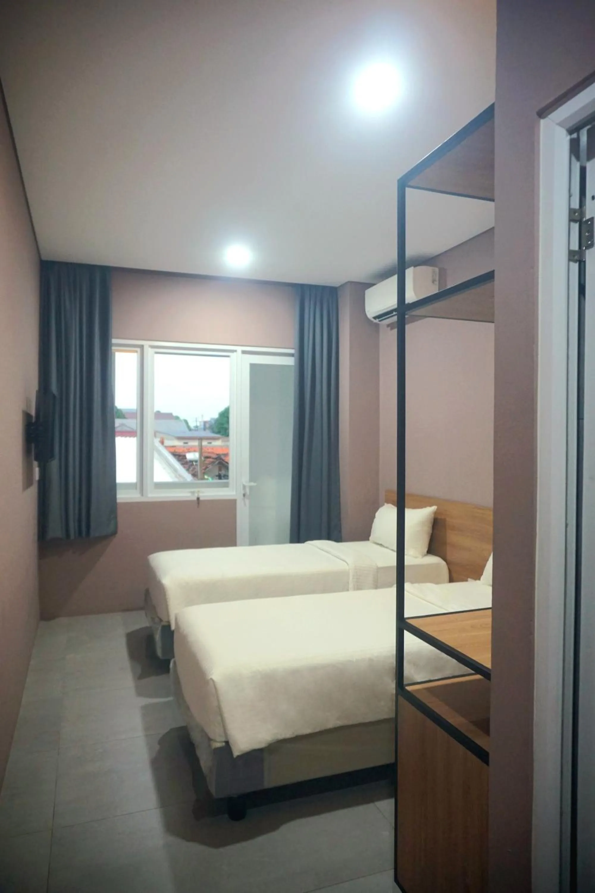 Deluxe Twin Room in VNC Alam Sutera Hotel Powered by Archipelago