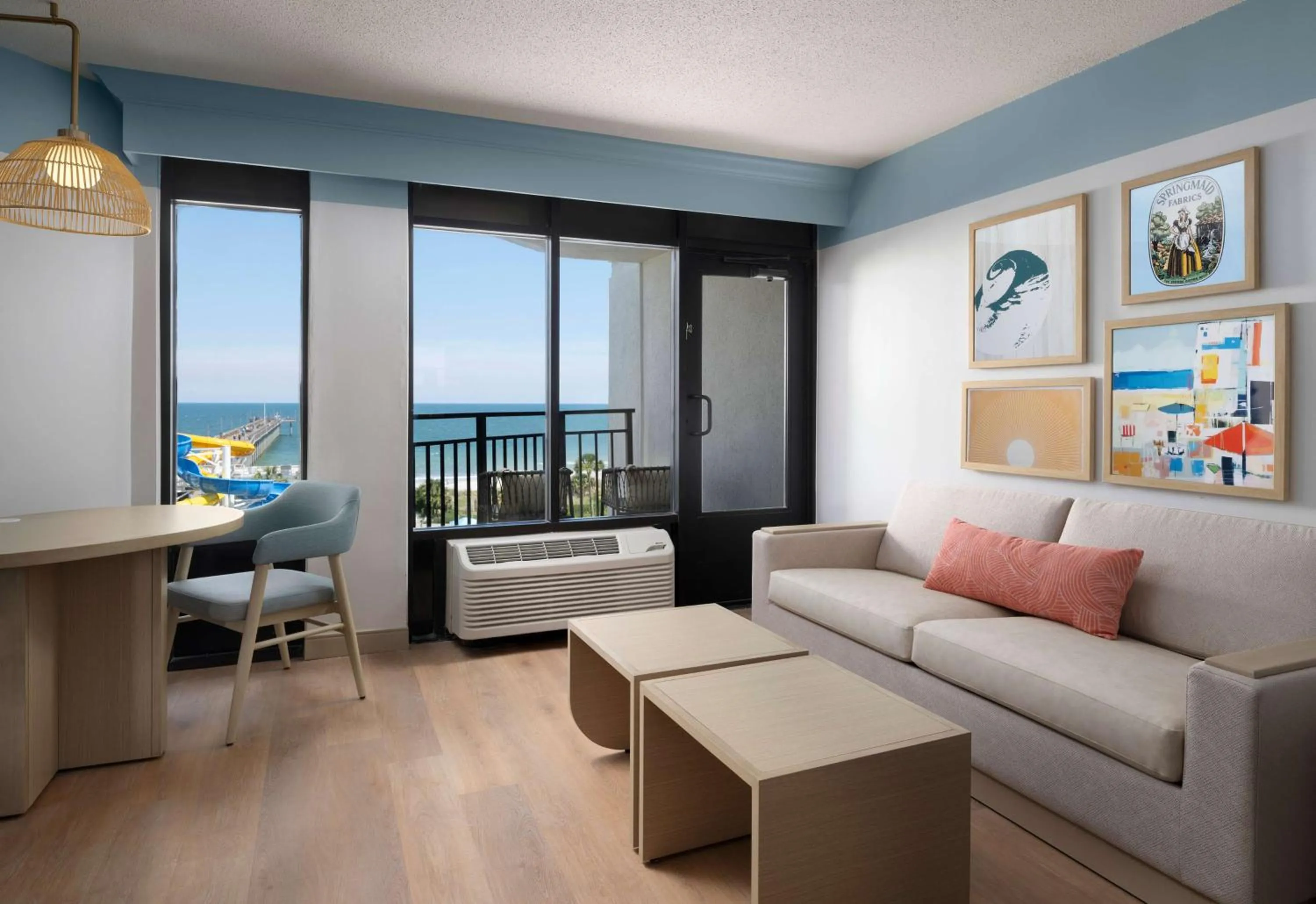 Junior King Suite with Seating Area in The Ellie Beach Resort Myrtle Beach, Tapestry By Hilton