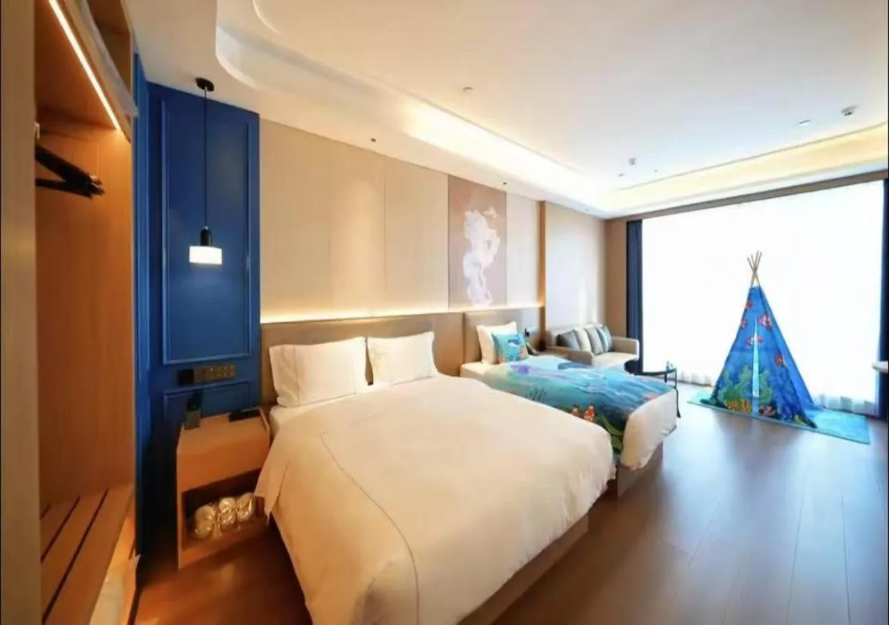 Deluxe Room with One King Bed and One Single Bed in Microtel by Wyndham Qingdao Huangdao