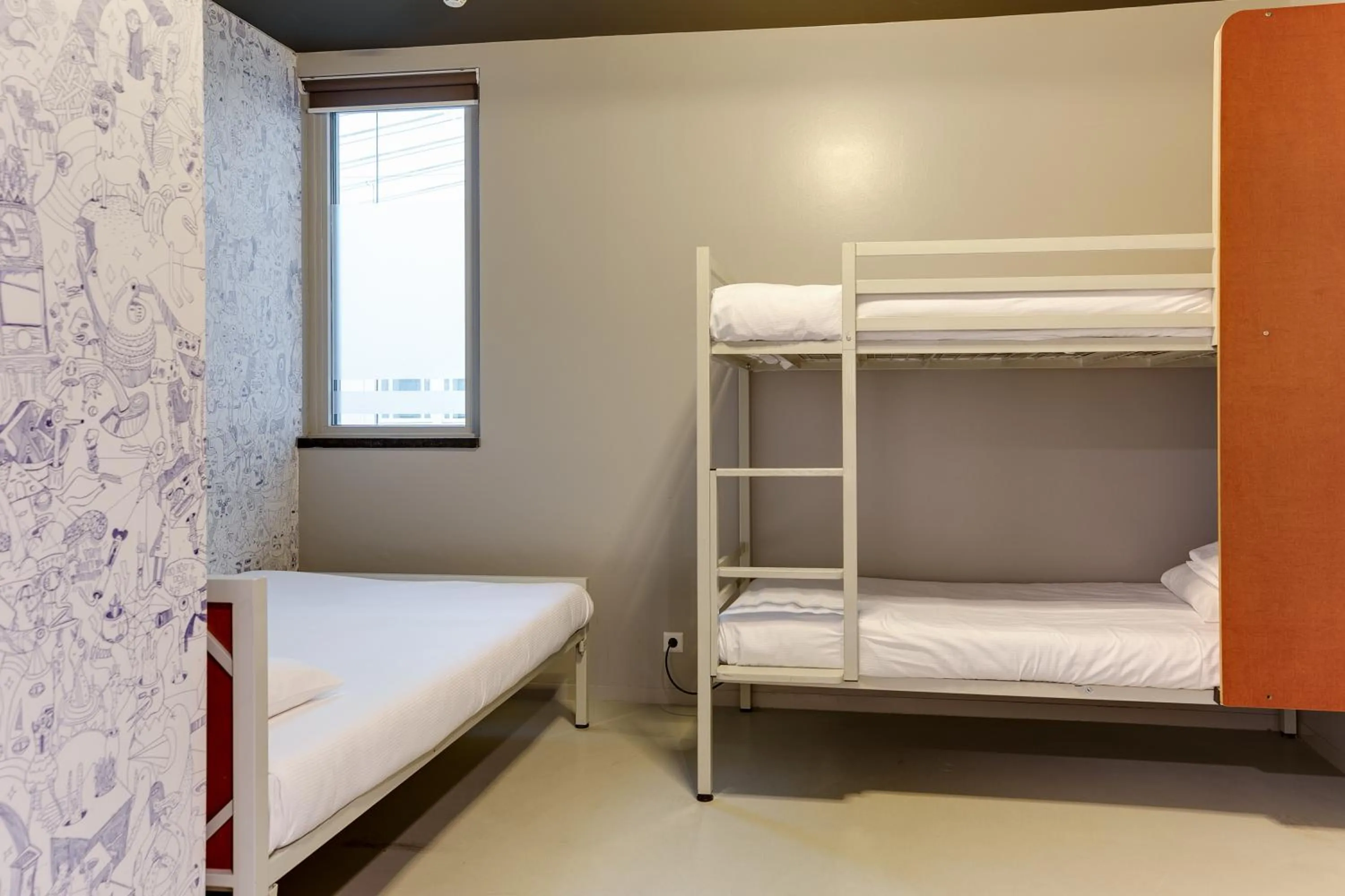 Private quadruple room with attached bathroom in ClinkNOORD Hostel