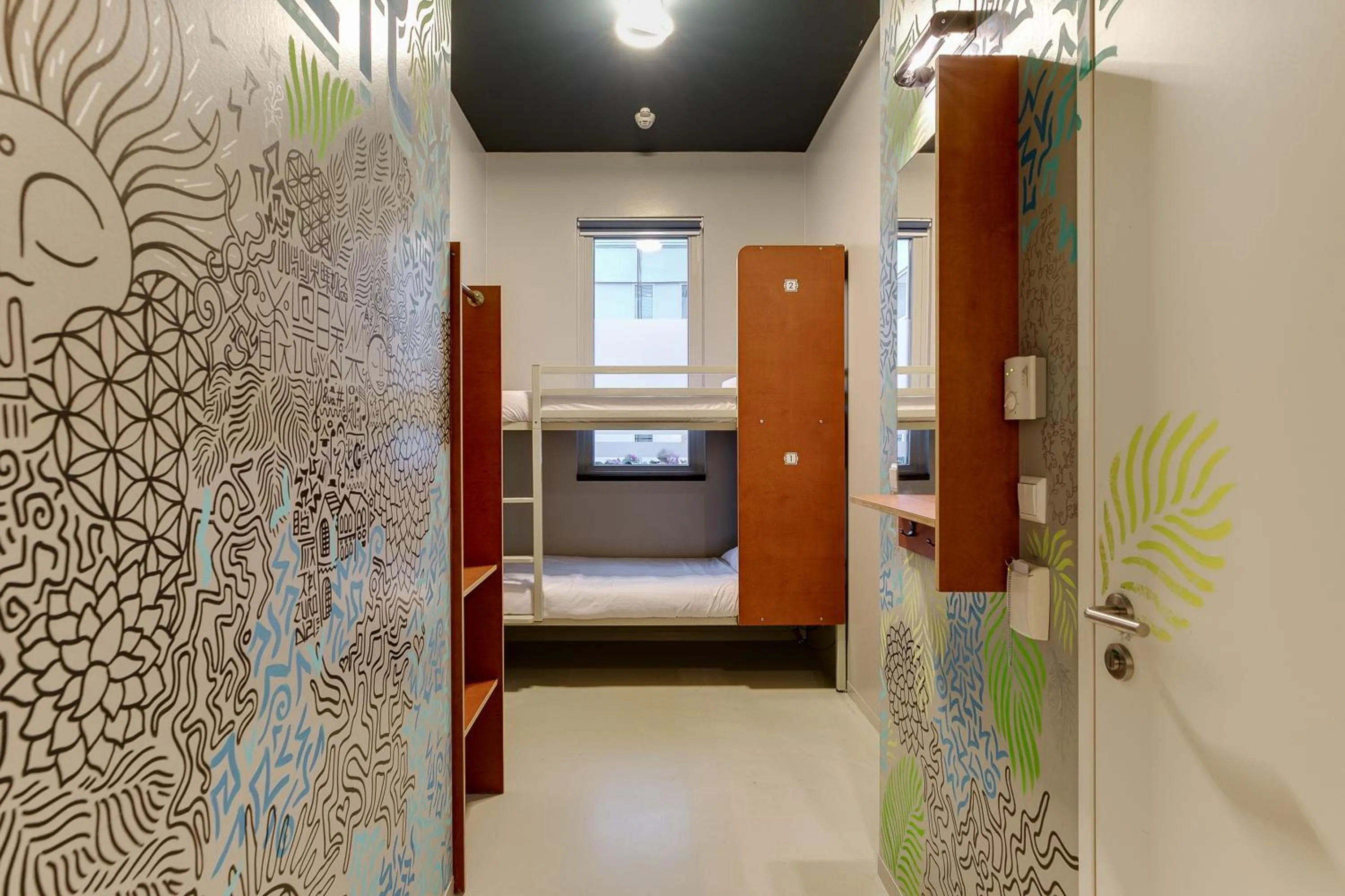 Private twin room with attached bathroom in ClinkNOORD Hostel