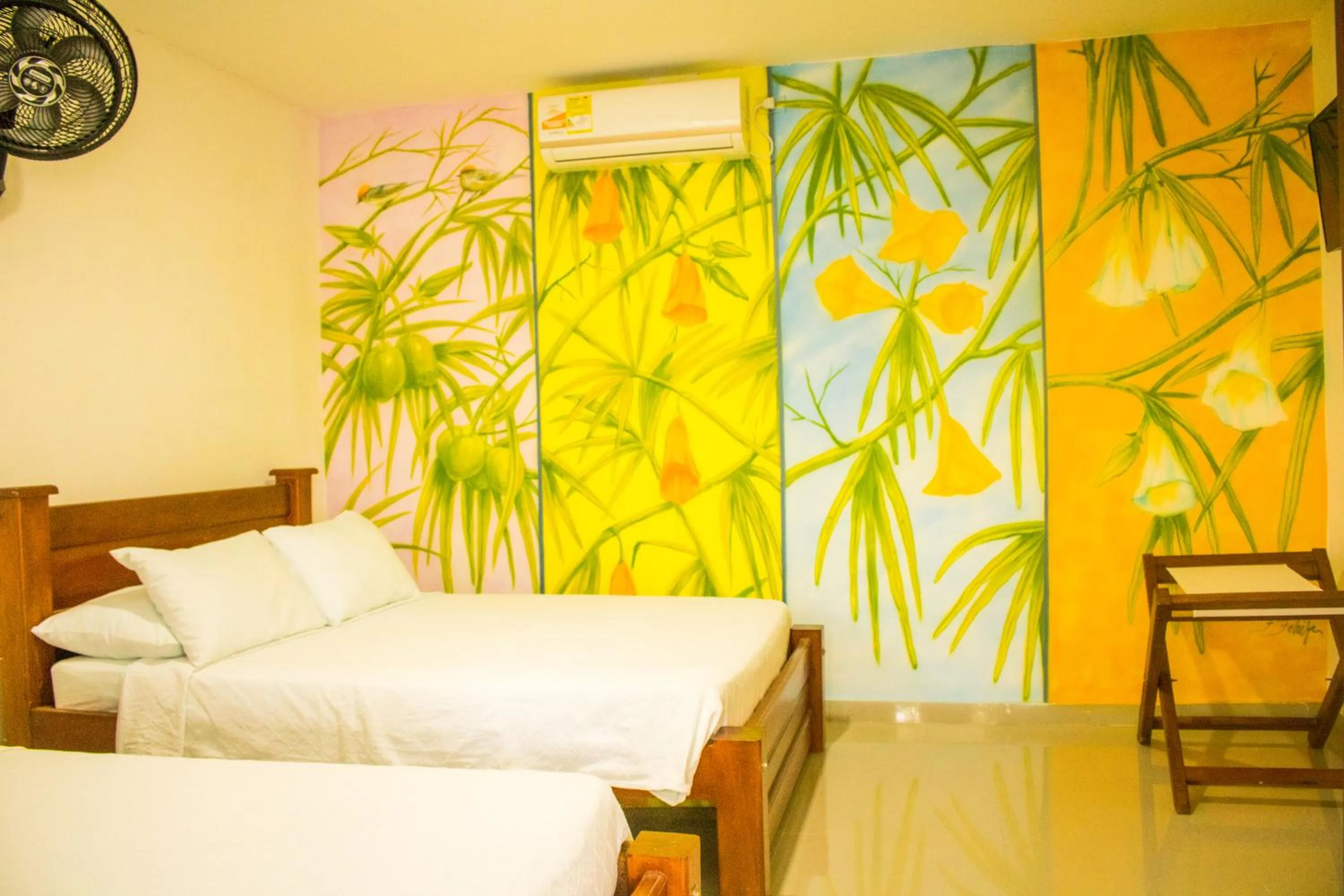 Classic Quadruple Room in Hotel Jardines Evans By GEH Suites