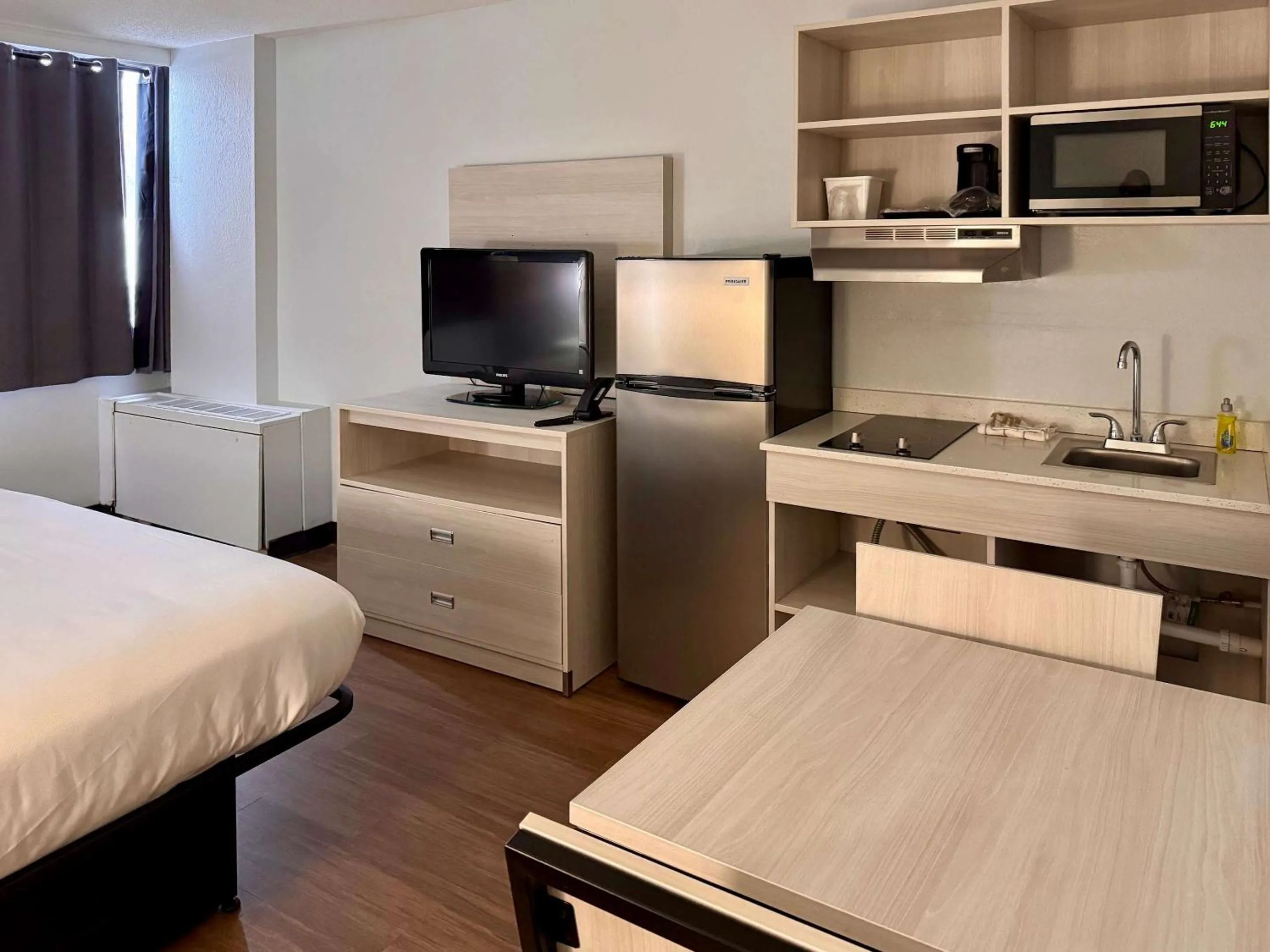 Efficiency Quadruple Room with Two Queen Beds - Non Smoking/Interior Hall in Suburban Studios East Syracuse Carrier Circle