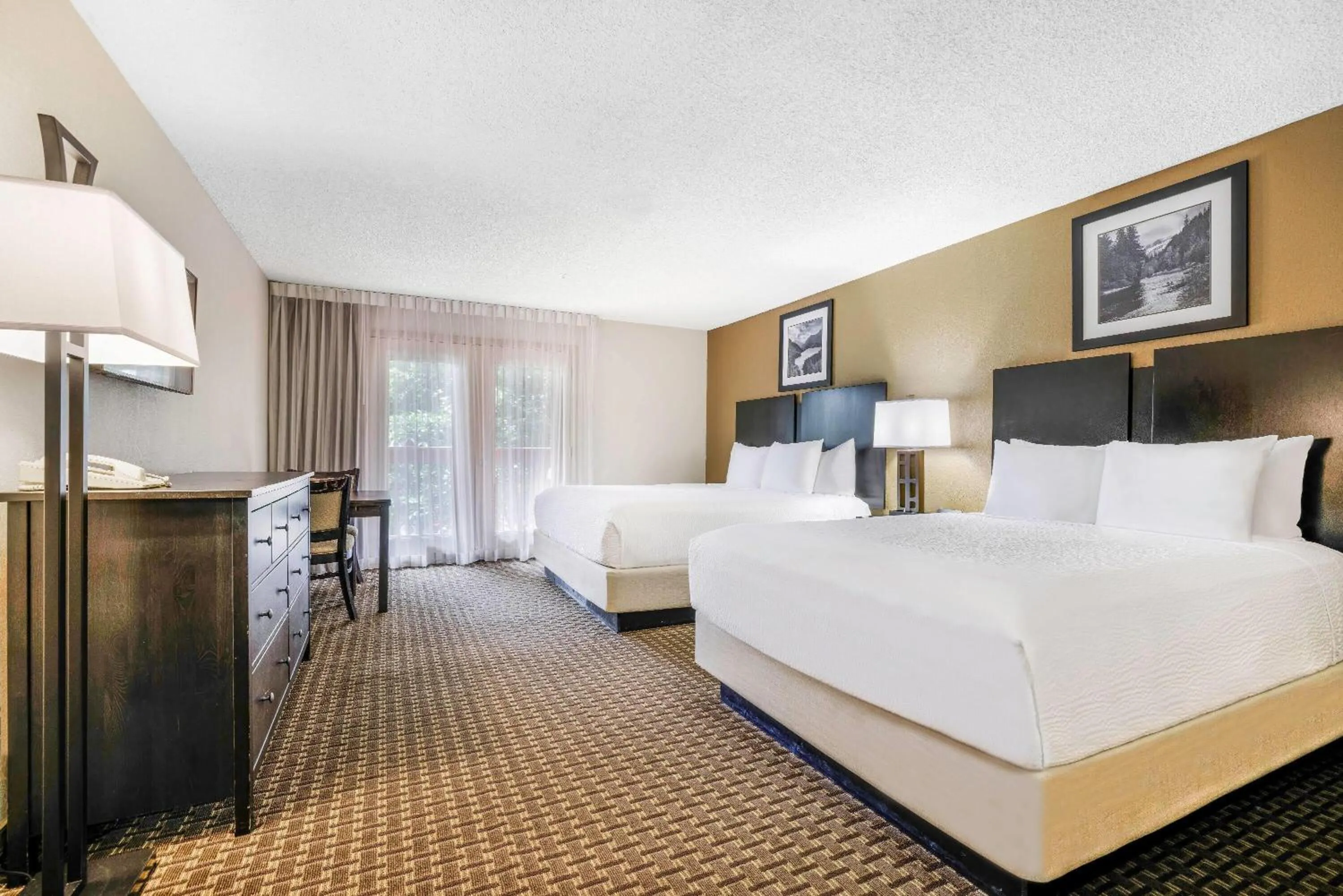 Deluxe Room with One King Bed and One Queen Bed - Non-Smoking in Baymont by Wyndham Cortez