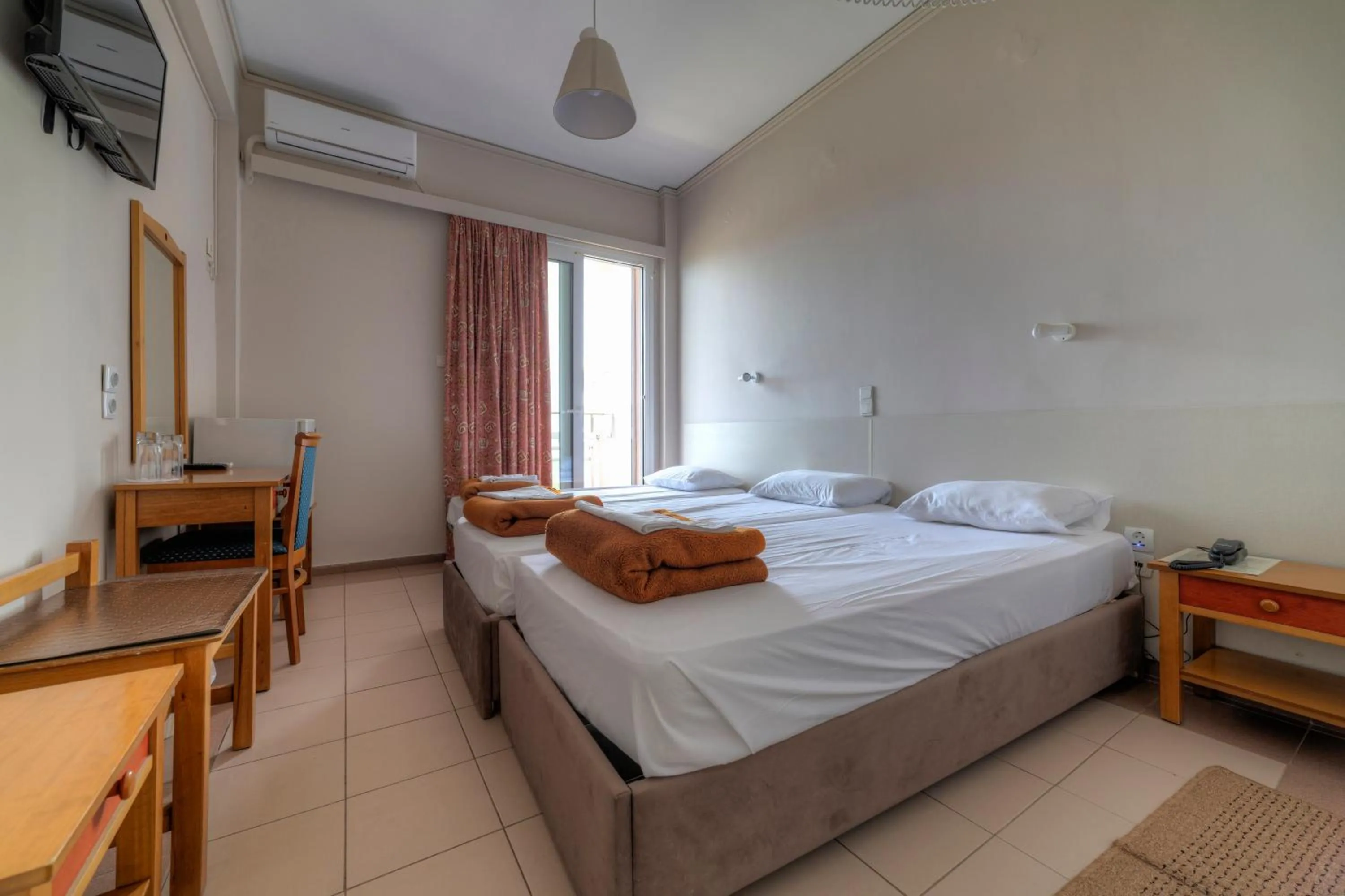 Triple Room with Balcony in Delfini Hotel