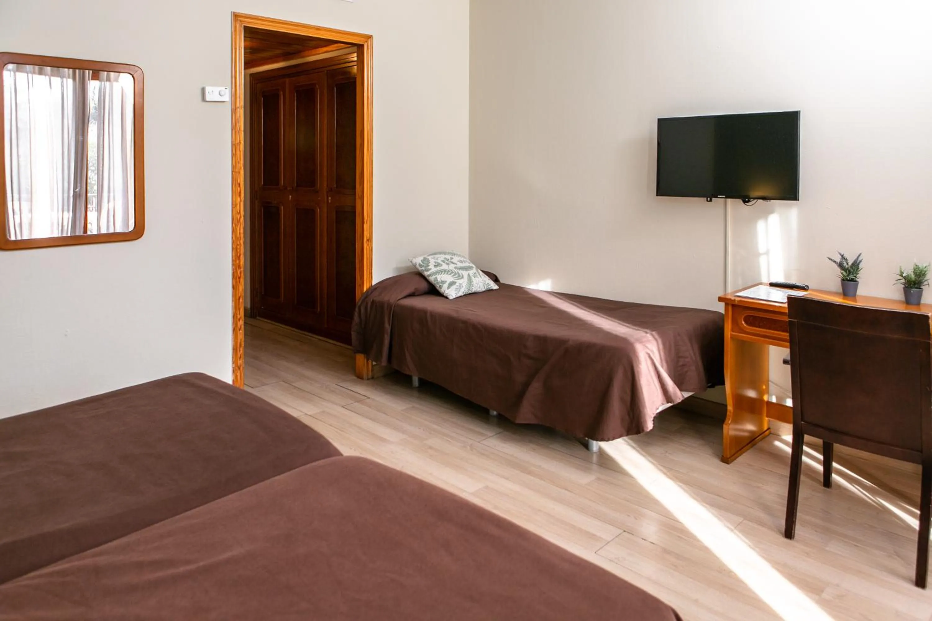 Superior Triple Room with Balcony in Hotel SNÖ Condes del Pallars