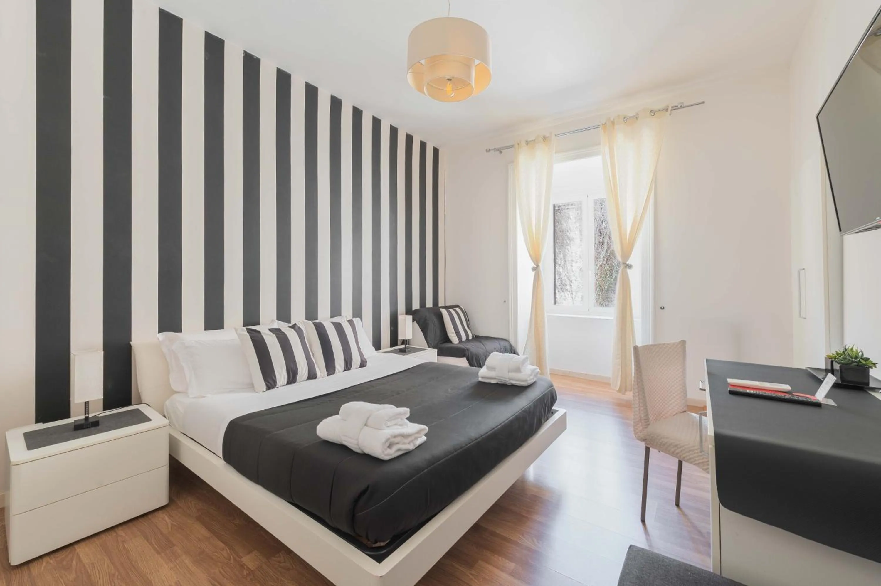 Deluxe Double Room (2 Adults + 1 Child) in Rione Monti Suites