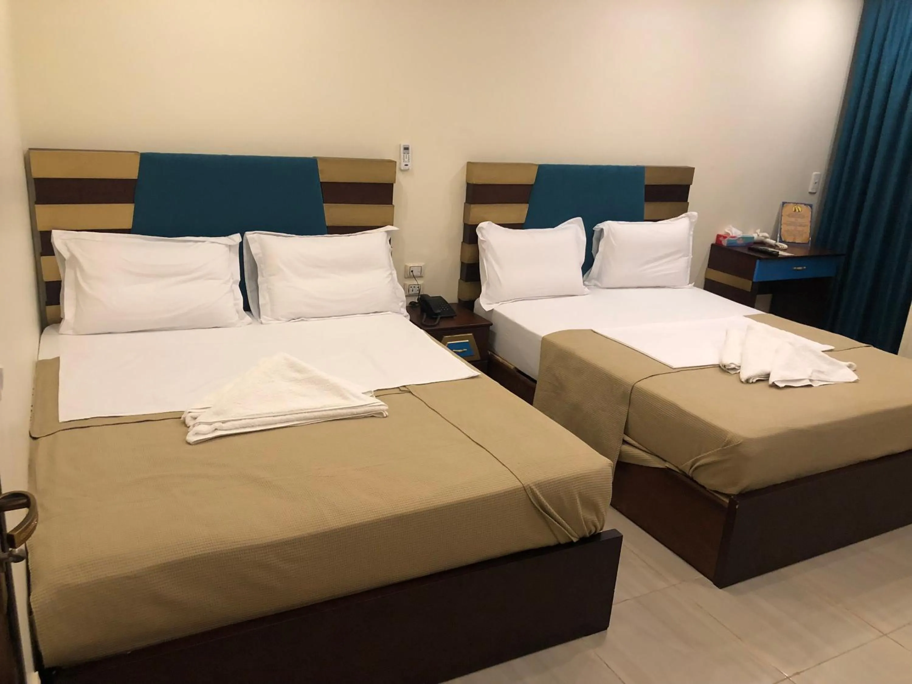 Standard Quadruple Room with window in Great Pyramid Inn